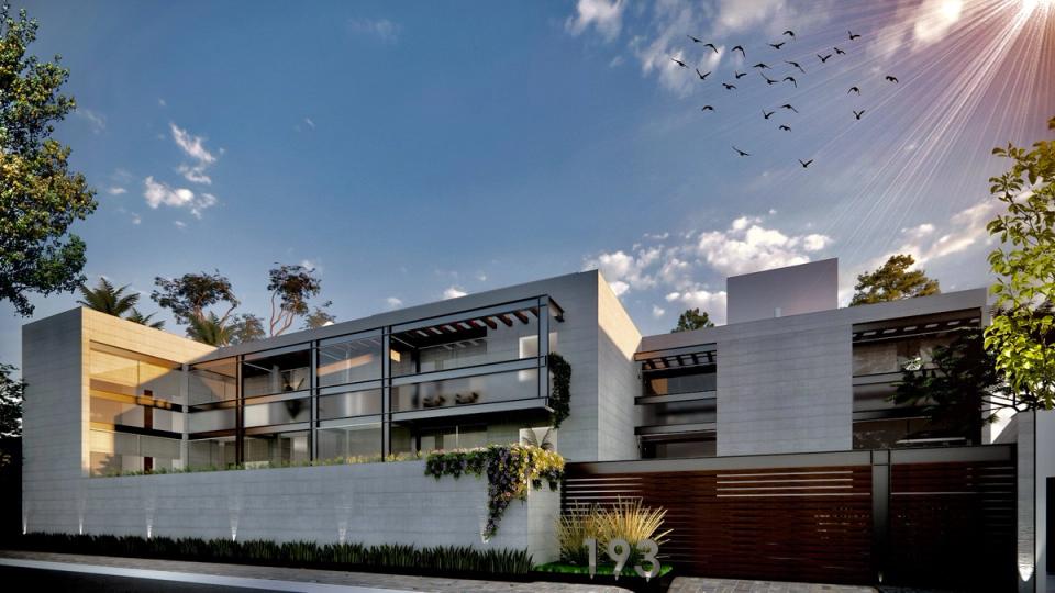 Edificio con pérgolas de madera y el número 193 junto al portón