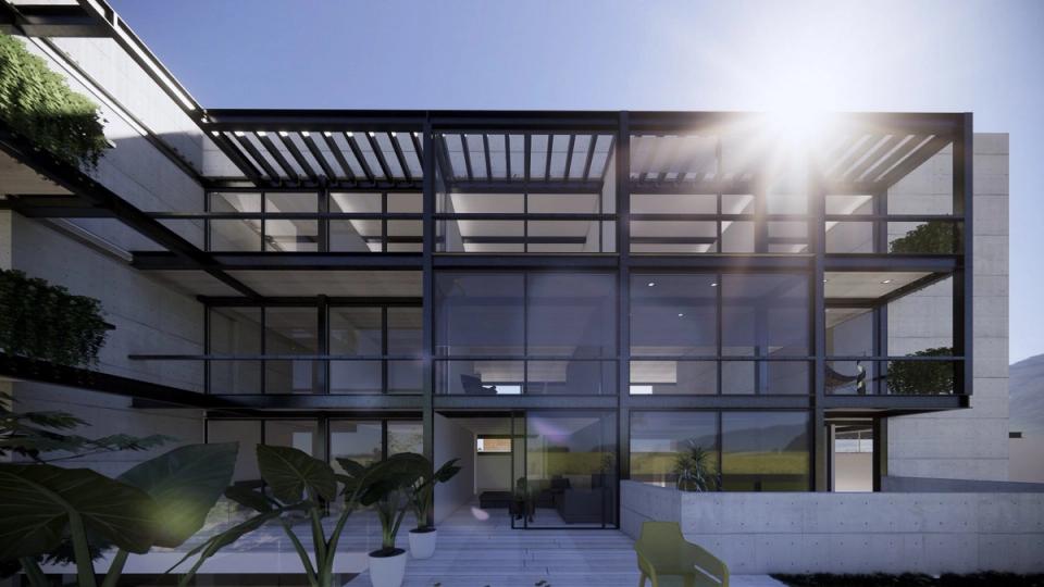 Fachada de acero y cristal con pérgolas vista desde la terraza