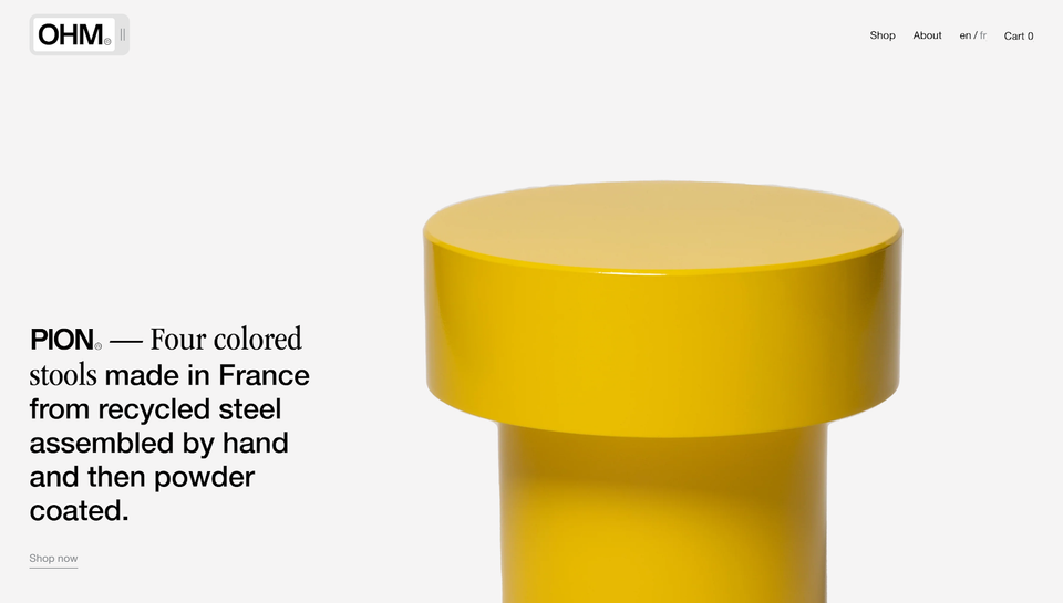 Homepage of OHM studio with simple, yellow geometrical form and typography.