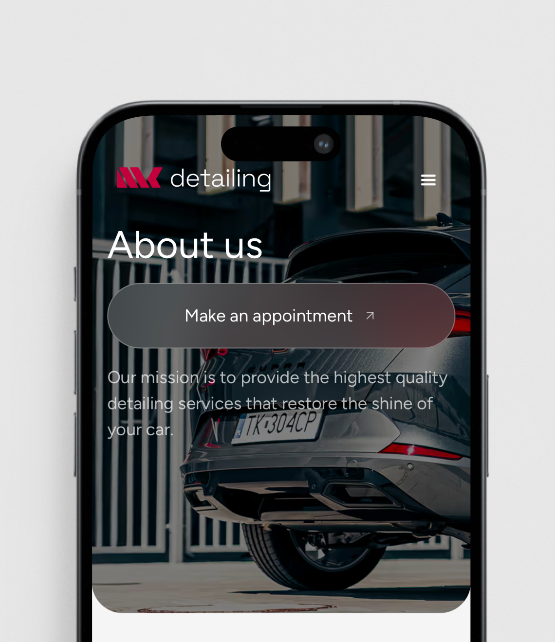 A mobile app interface for a car detailing service displays their "About Us" page with a mission statement and appointment booking button over an image of a vehicle's rear end.
