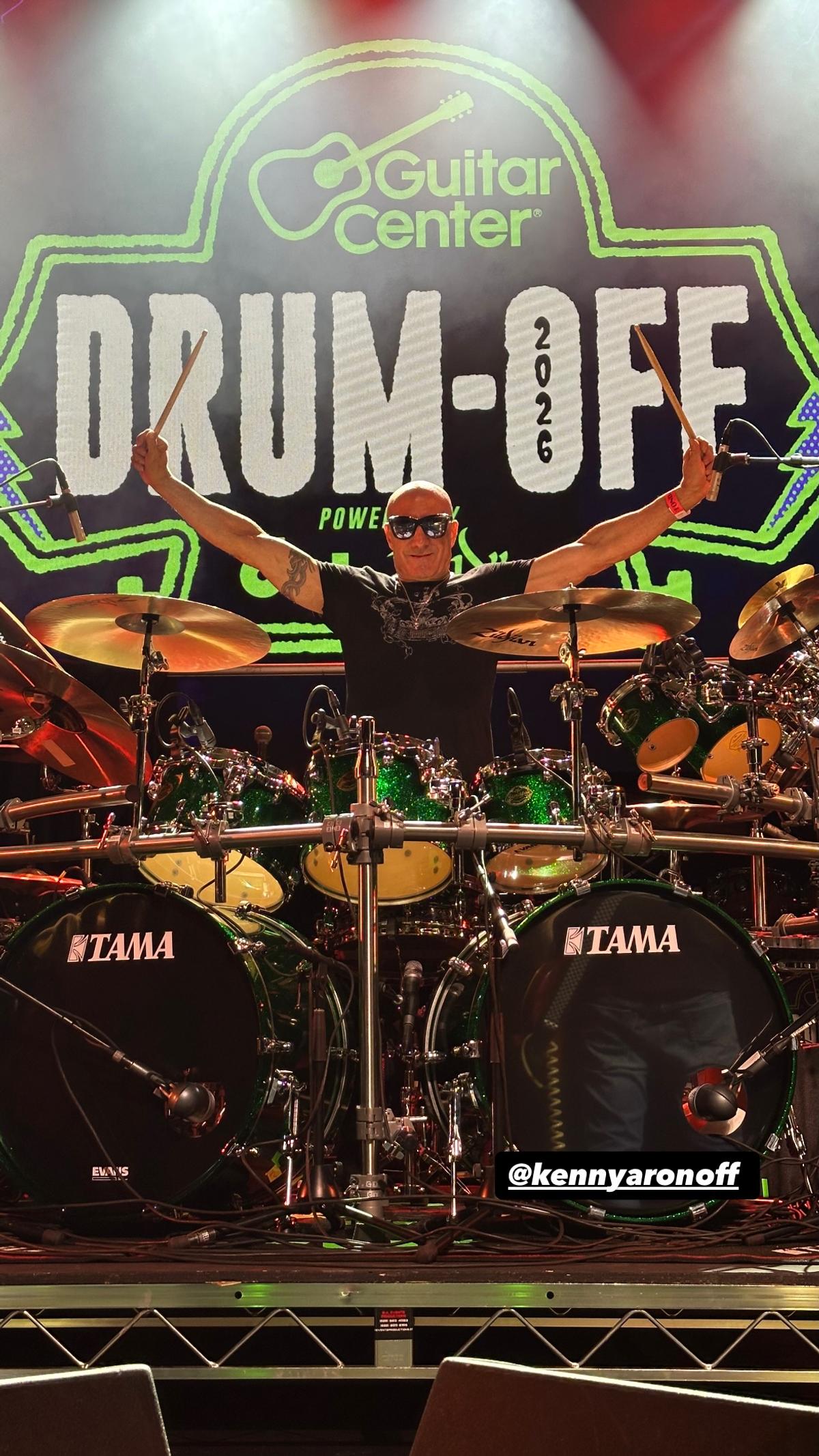 Kenny Aronoff behind a kit on The Fonda stage, under a giant Drum-Off 2026 backdrop