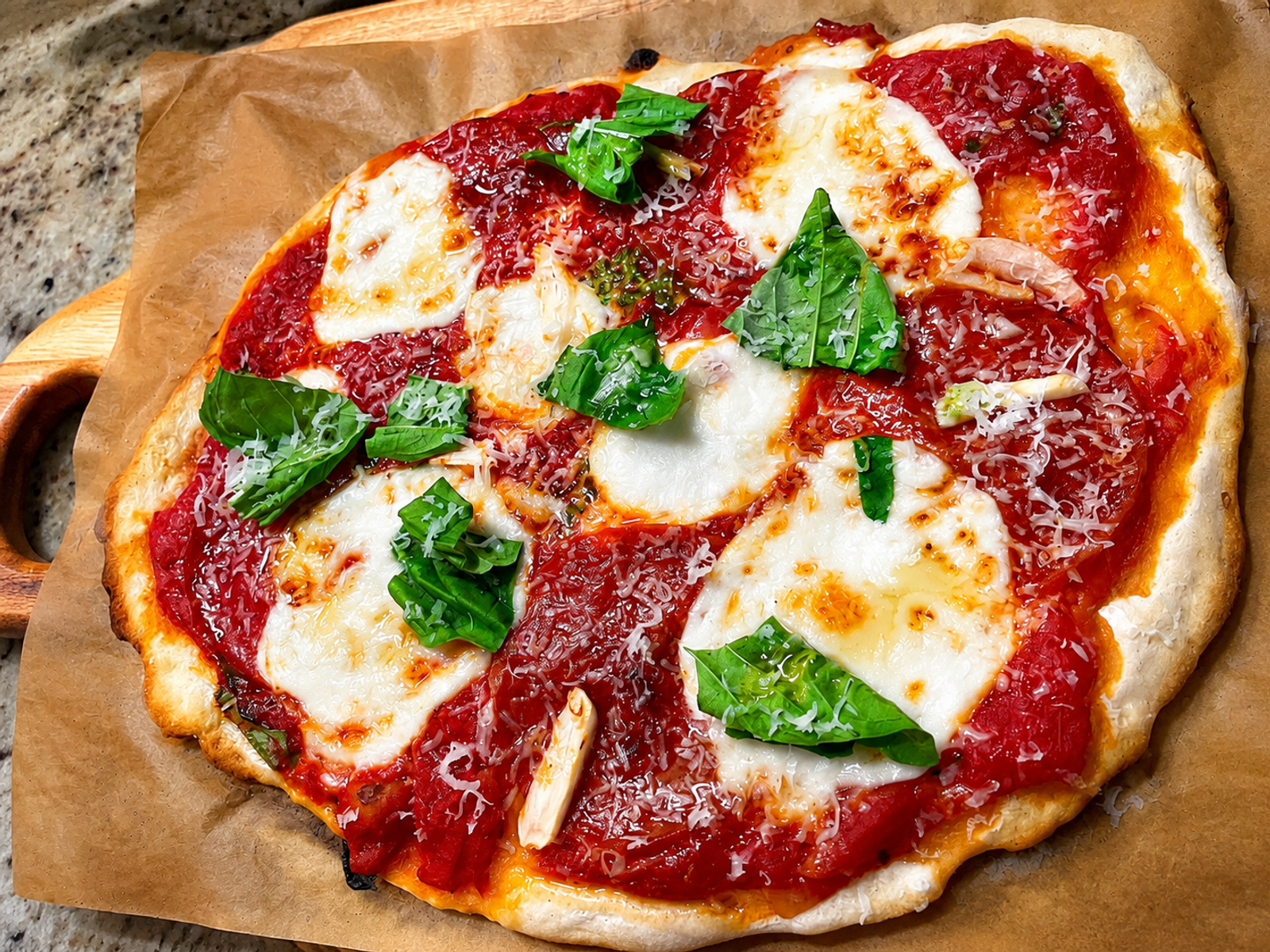 Homemade margherita pizza with fresh basil