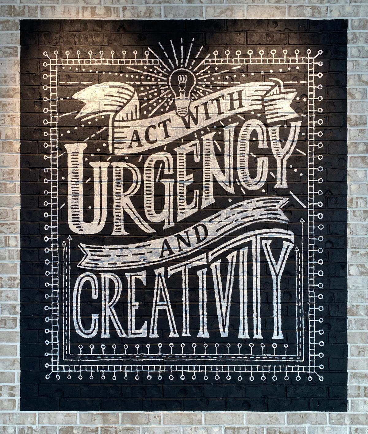 Act With Urgency and Creativity hand-lettered mural at LendingTree