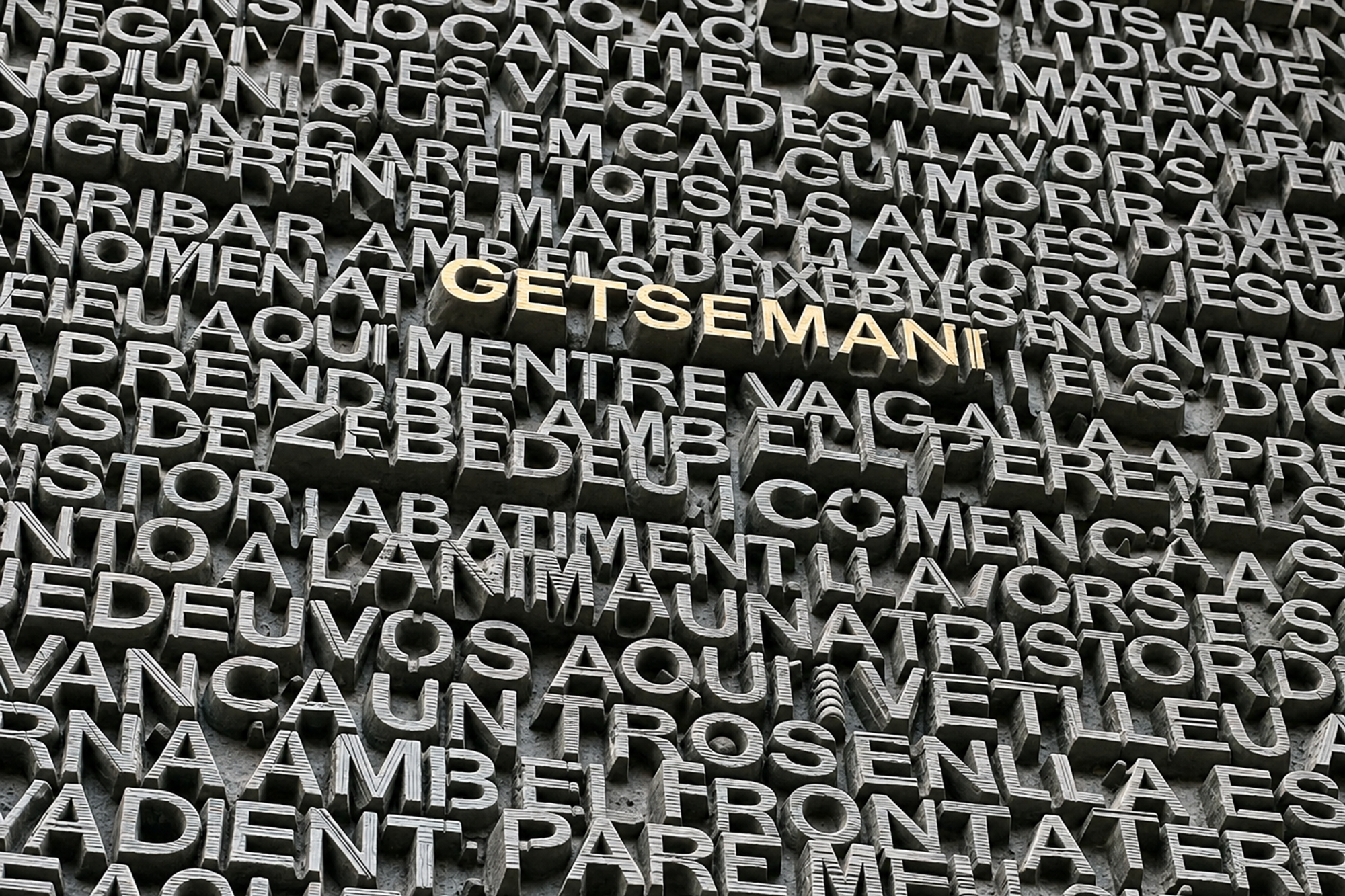 Bronze lettering on a Sagrada Família door in Barcelona, with Getsemaní picked out in gold