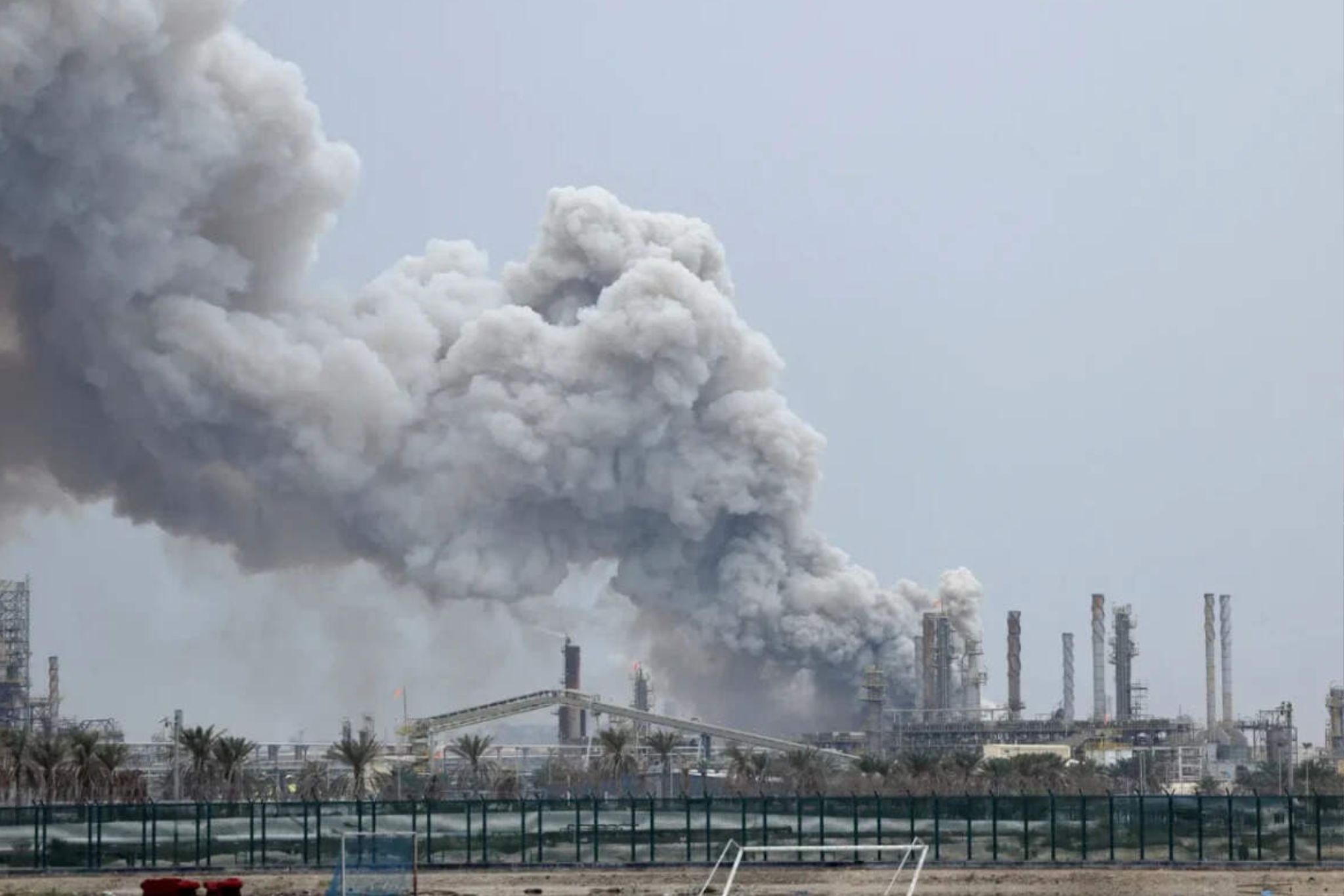 Smoke rises following a strike on Al-Ahmadi oil refinery