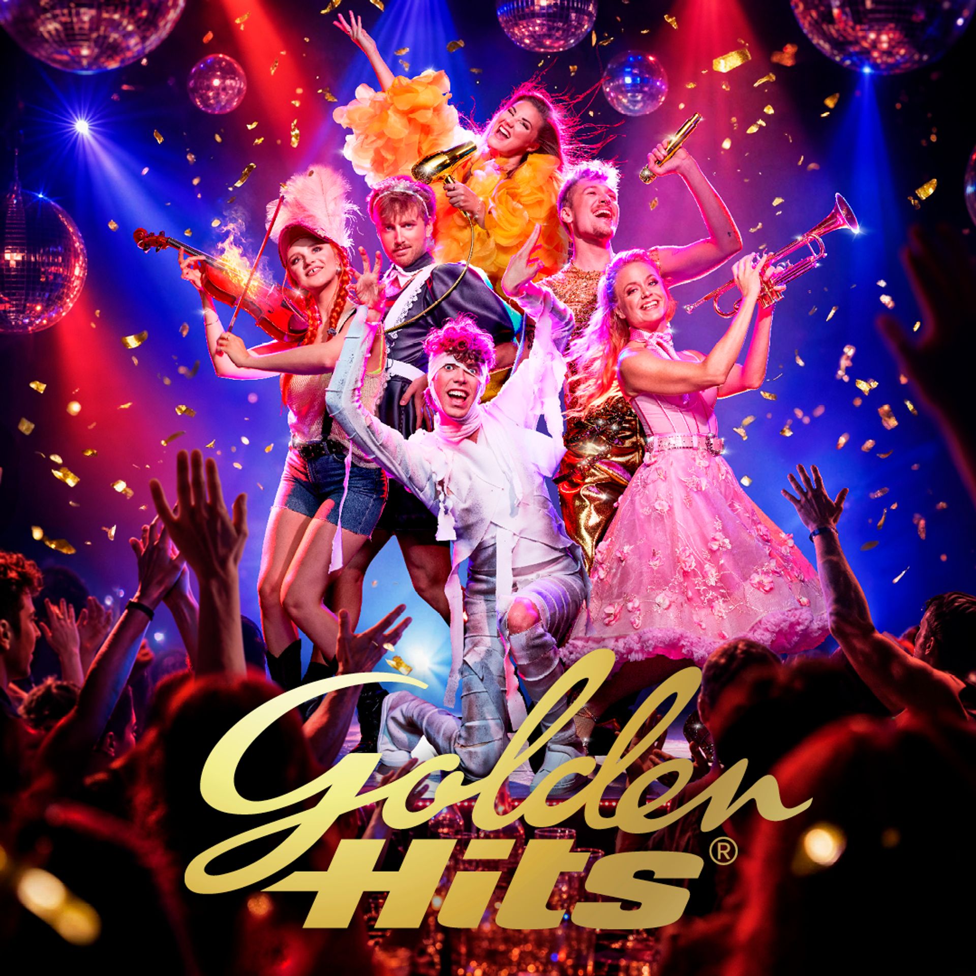 Golden Hits dinnershow med sex artister på scen i färgglada scenkläder. Publiken jublar och konfetti faller.