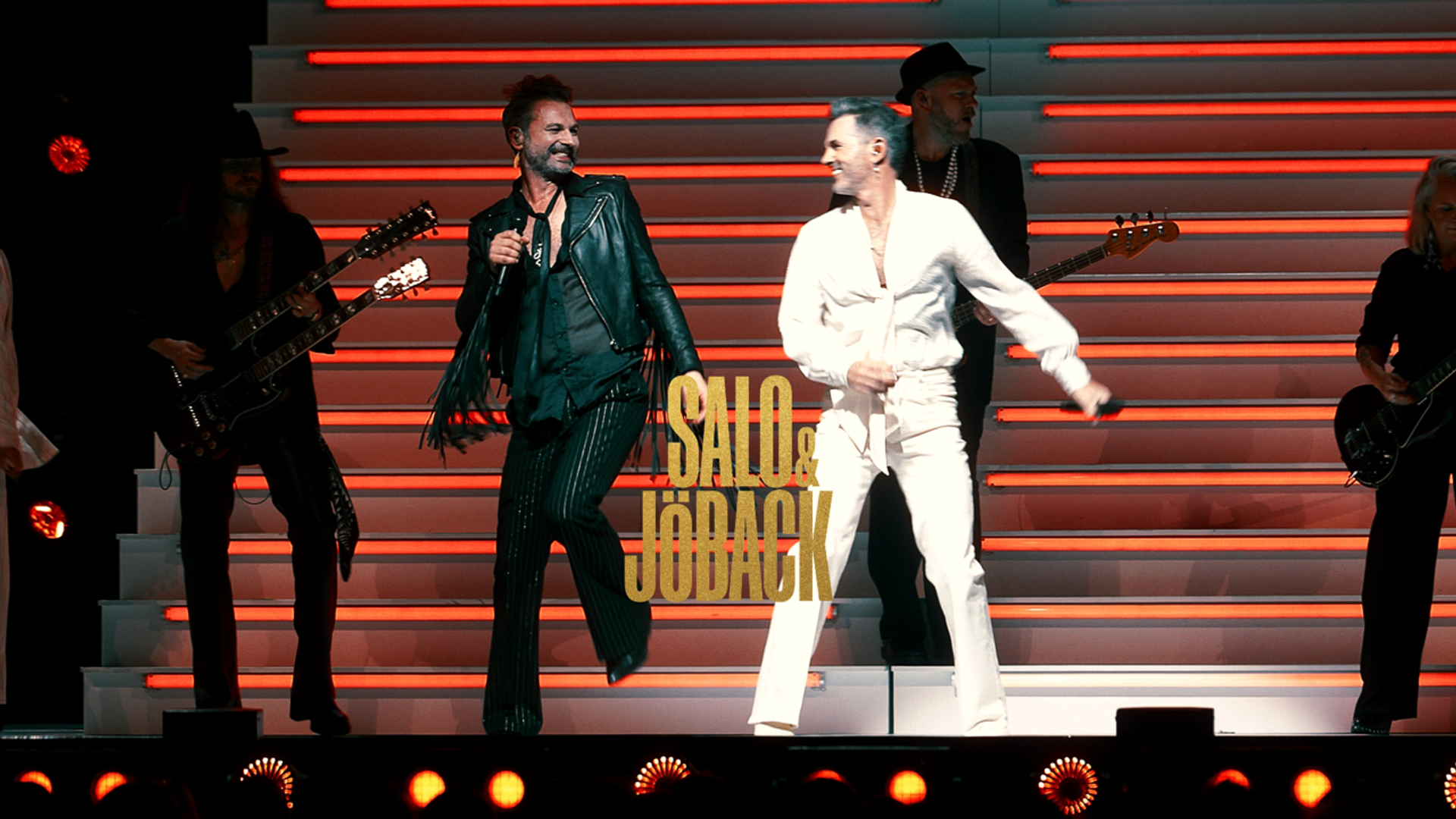 Thumbnail bild för Salo & Jöbacks show A show extravaganza. Peter Jöback hel vita kläder och Ola Salo i helsvarta kläder på scen