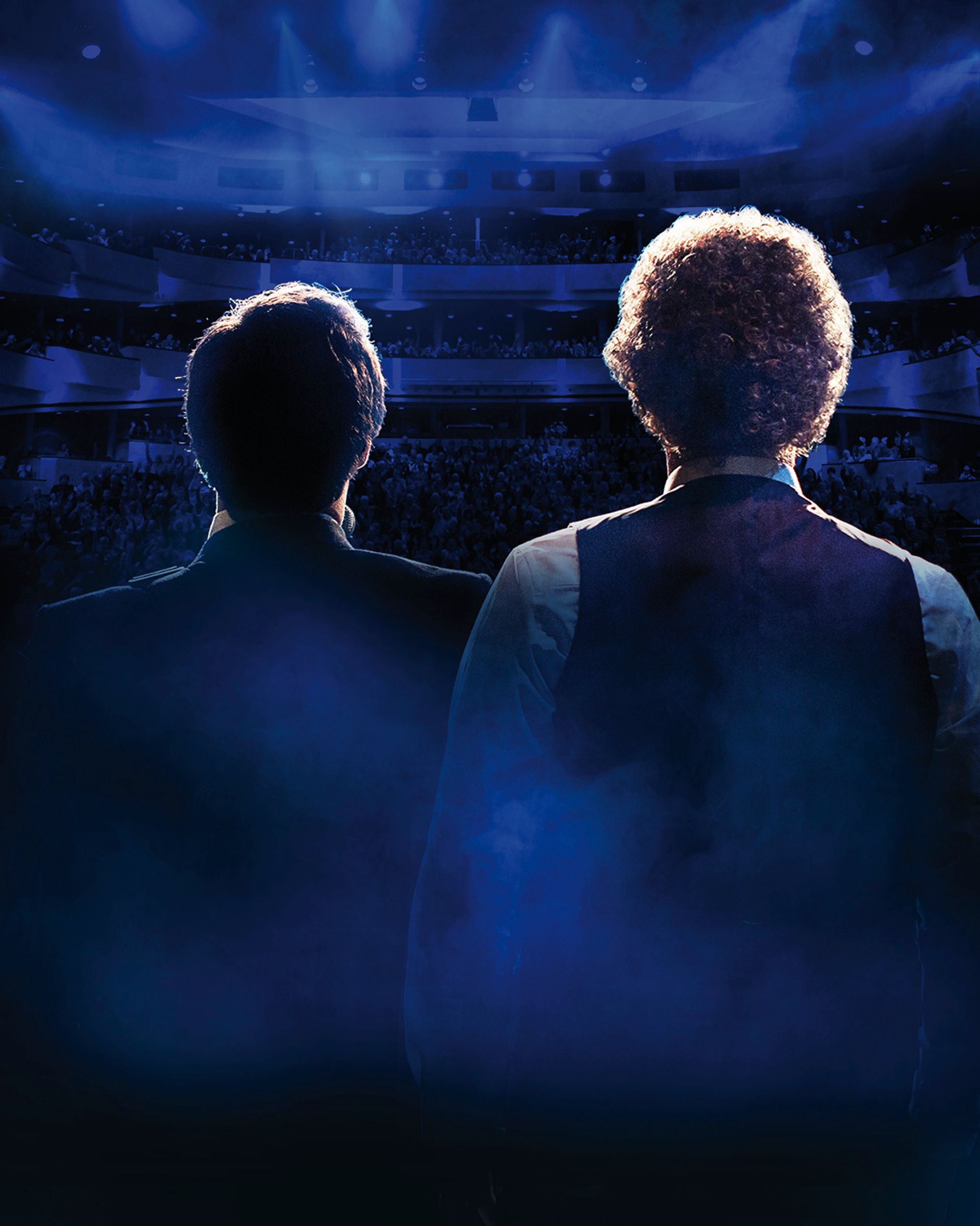 Manér bild för The Simon & Garfunkel Story. Två killar står och kollar ut över en teater publik och fotot är taget bakom deras huvuden.
