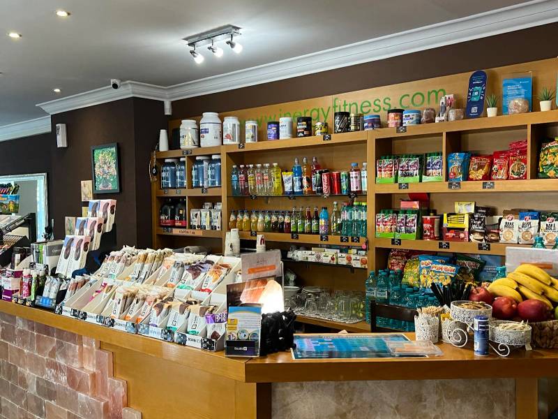 The bar: a counter of salt bricks, behind it shelves of shakes, drinks, protein bars and a bowl of fruit.