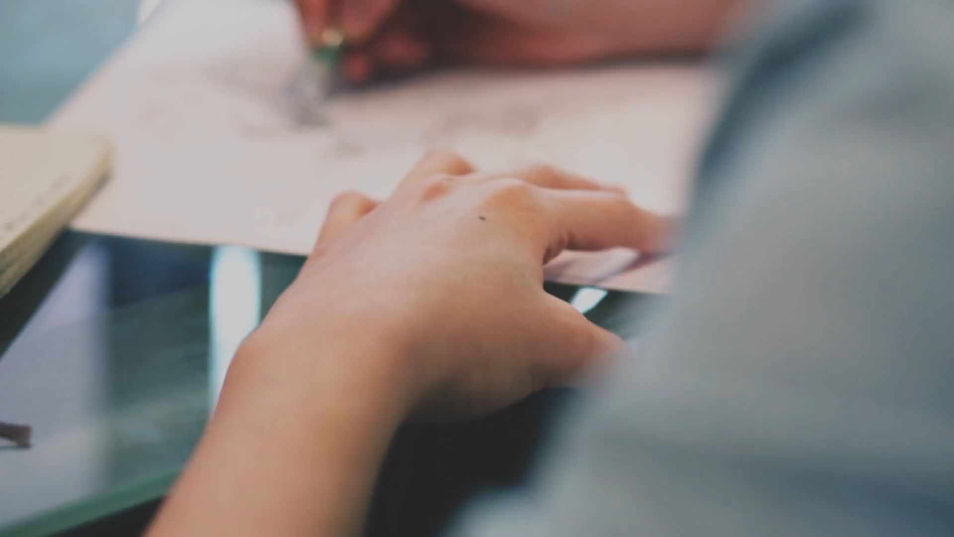First frame of the Tranquiliti video showing hands using a laptop.