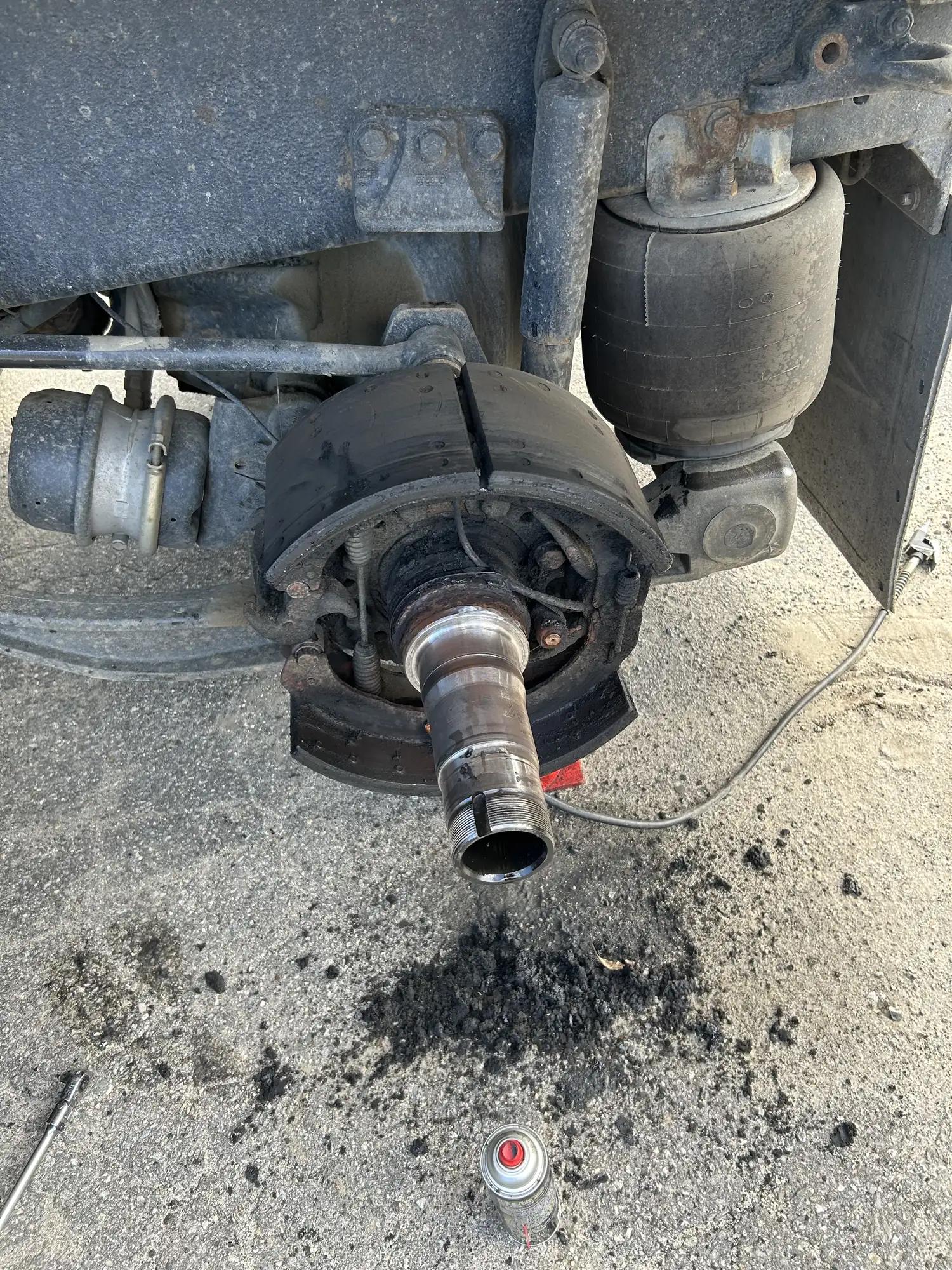 Trailer axle spindle cleaned after hub removal for a wheel seal job
