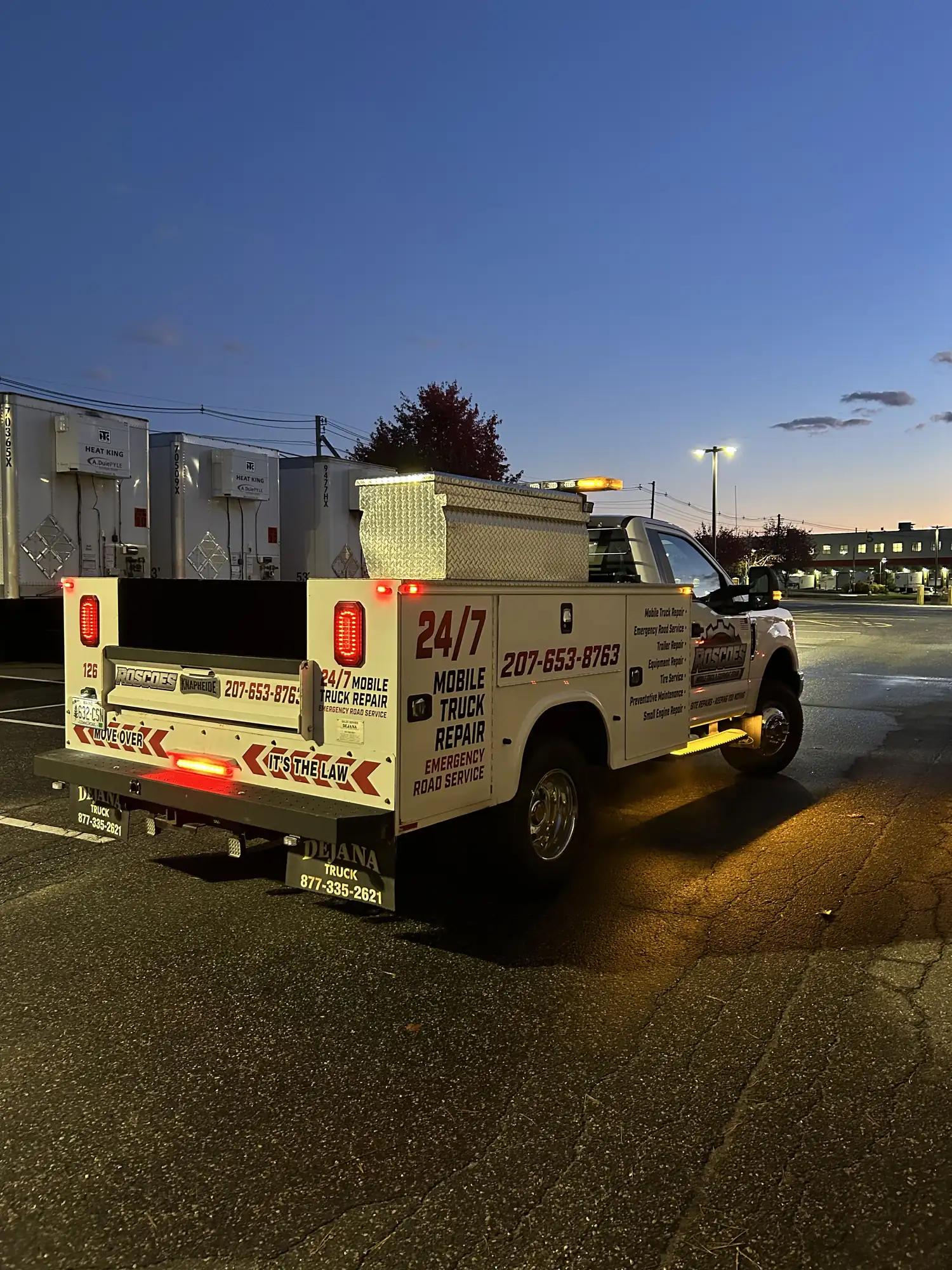 Roscoe's mobile repair truck on a night road call at a lot