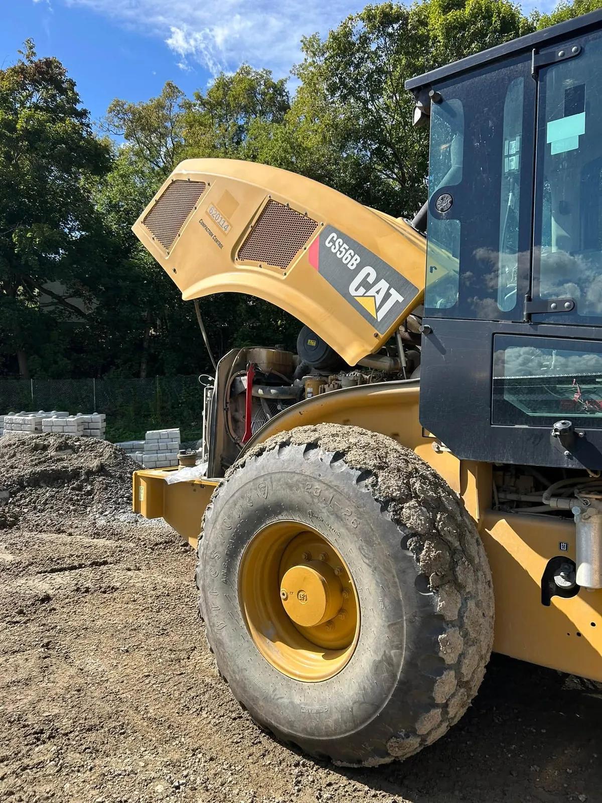 Heavy equipment with hood raised