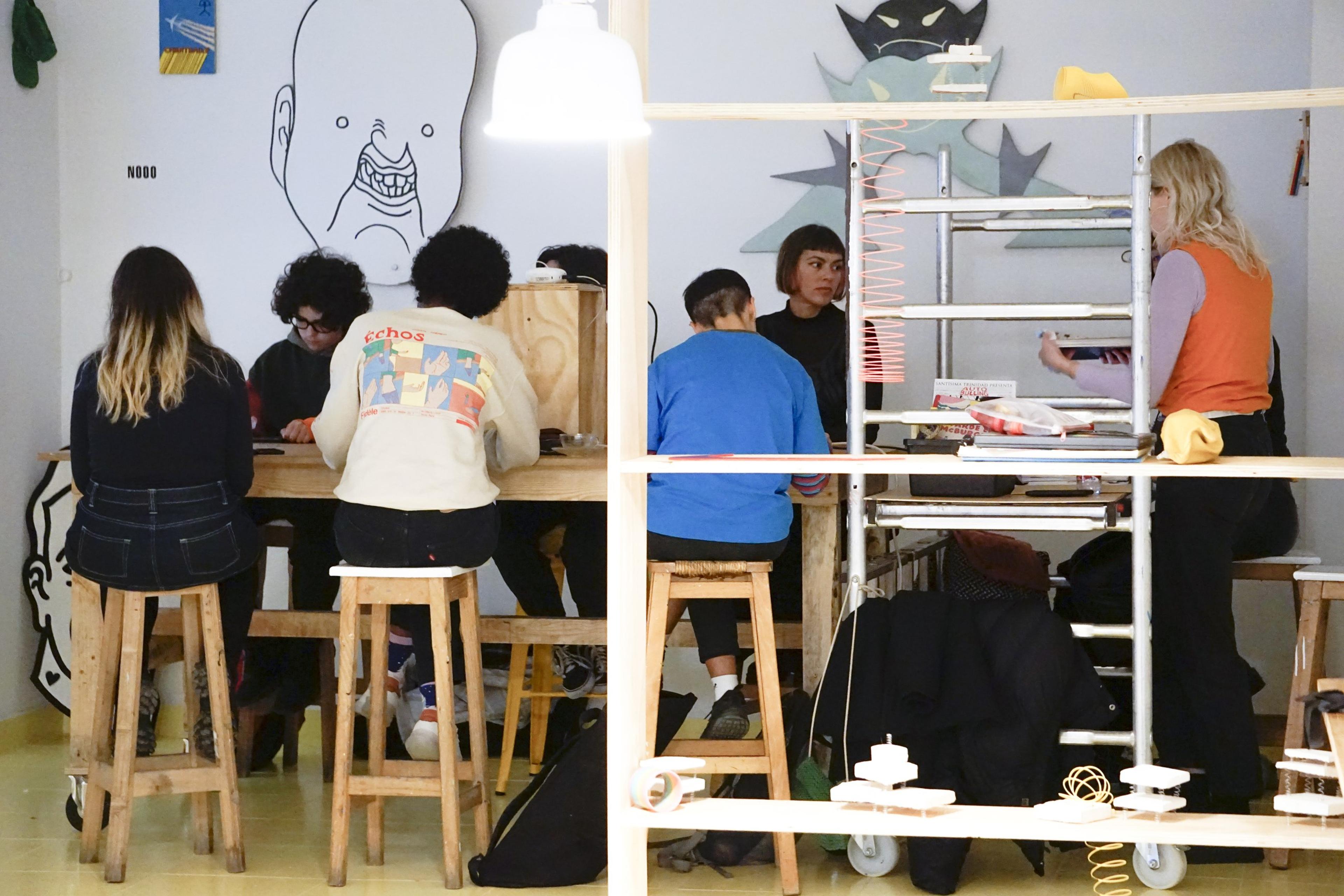 Participants working together at a long table