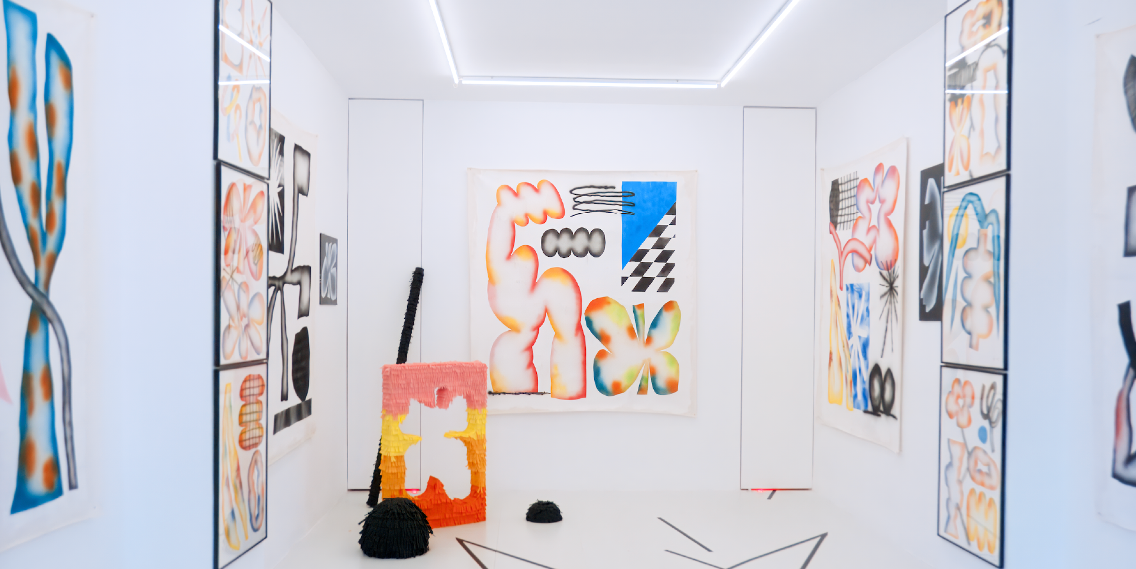 Installation view of Ultramegabum with abstract paintings, drawings and black floor markings in a white gallery.
