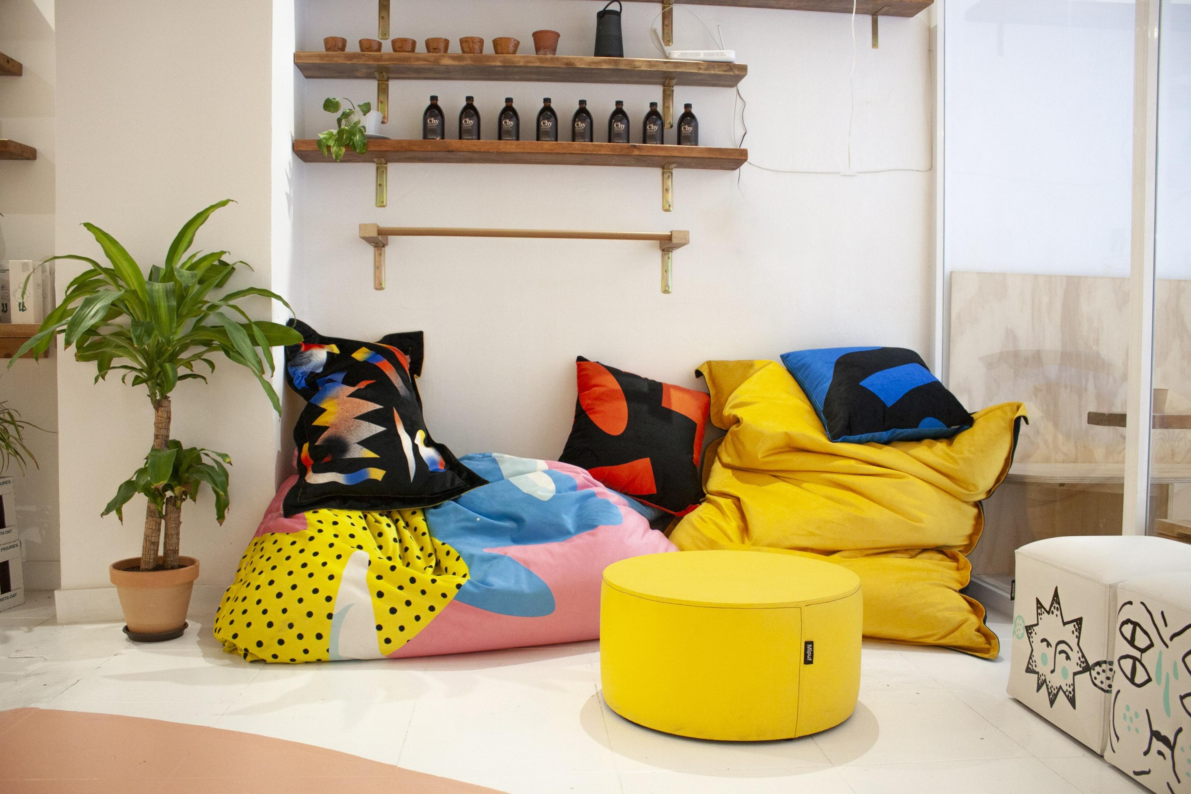 Colourful textiles and seating inside Maneiras Café