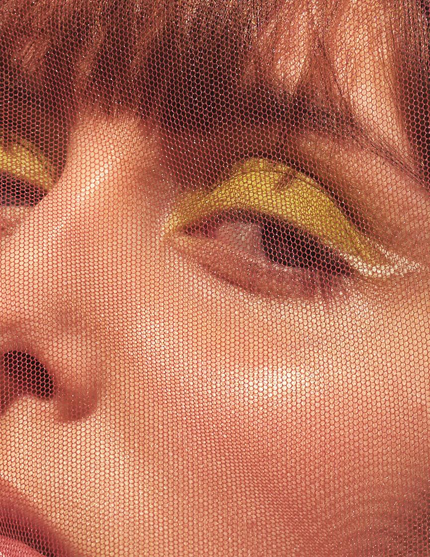 detail view of female model under mesh garment
