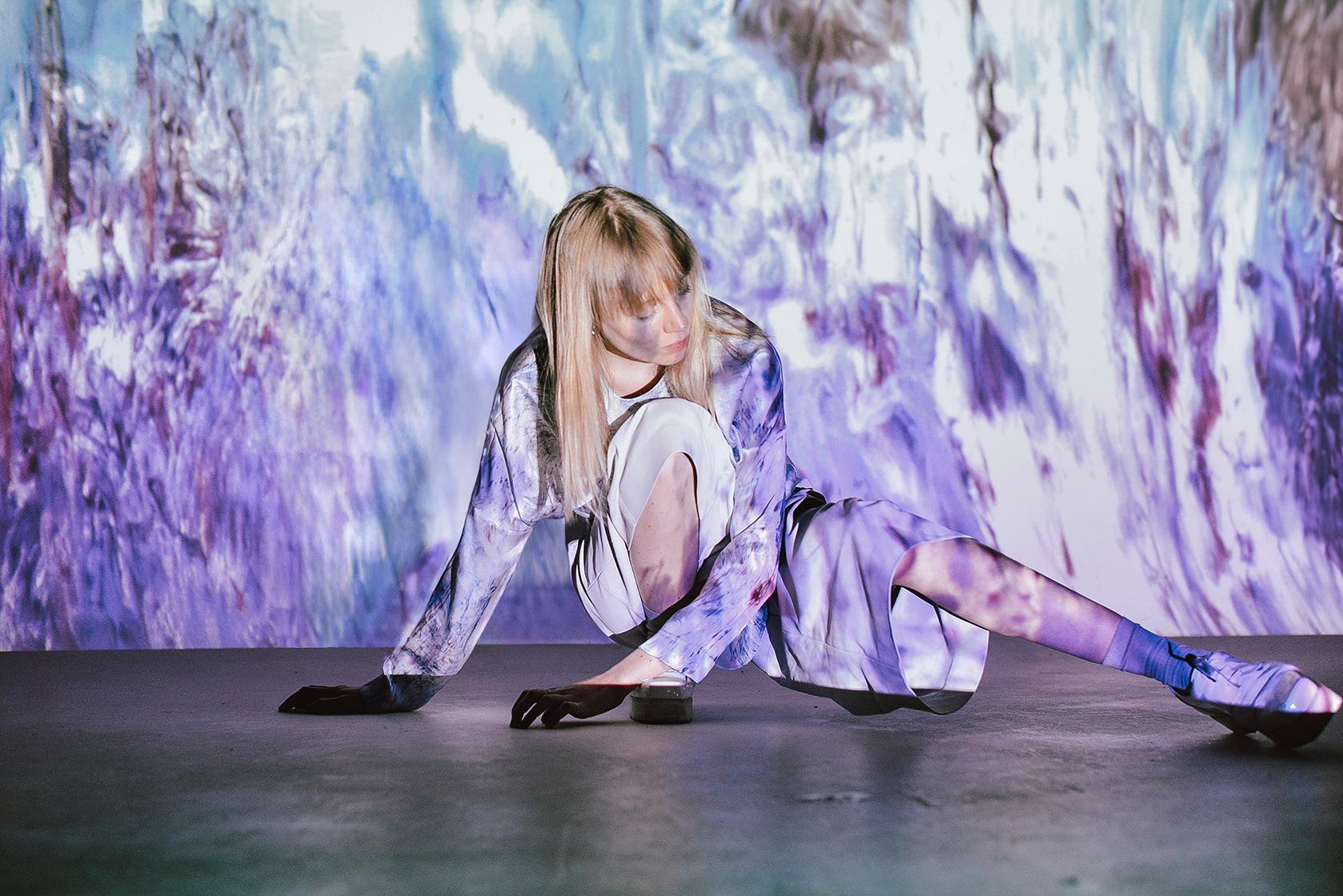 abstract projection on female model on the floor