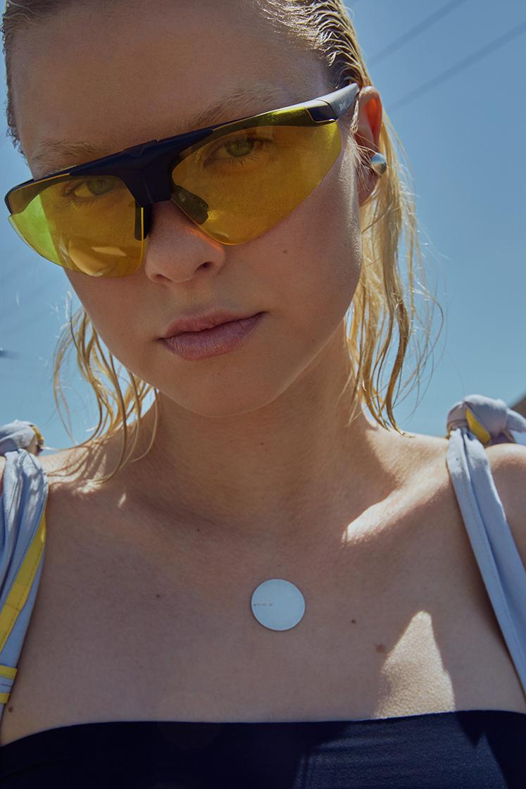 female model with yellow glasses