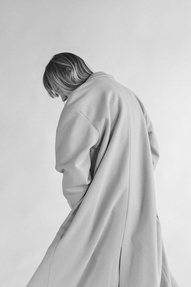 female model turning in motion black and white