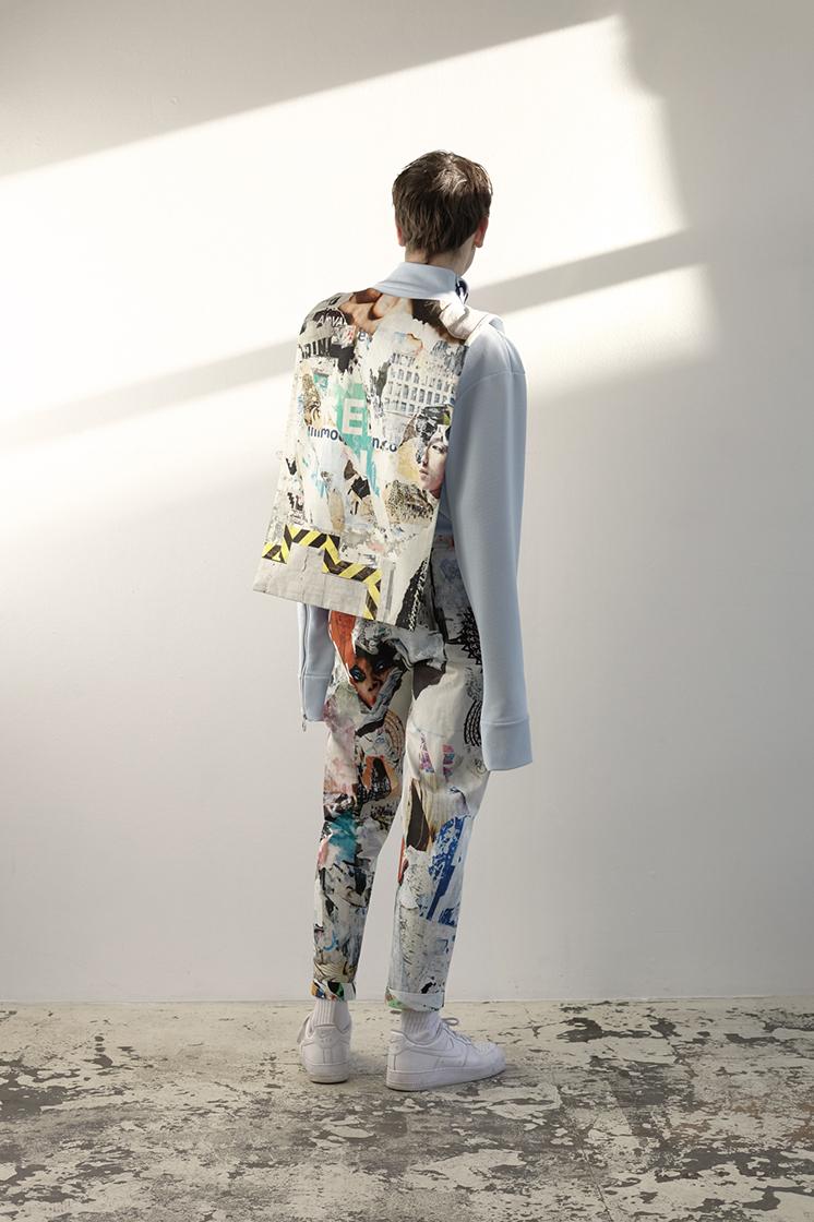male model shown from the back in front of sun reflection
