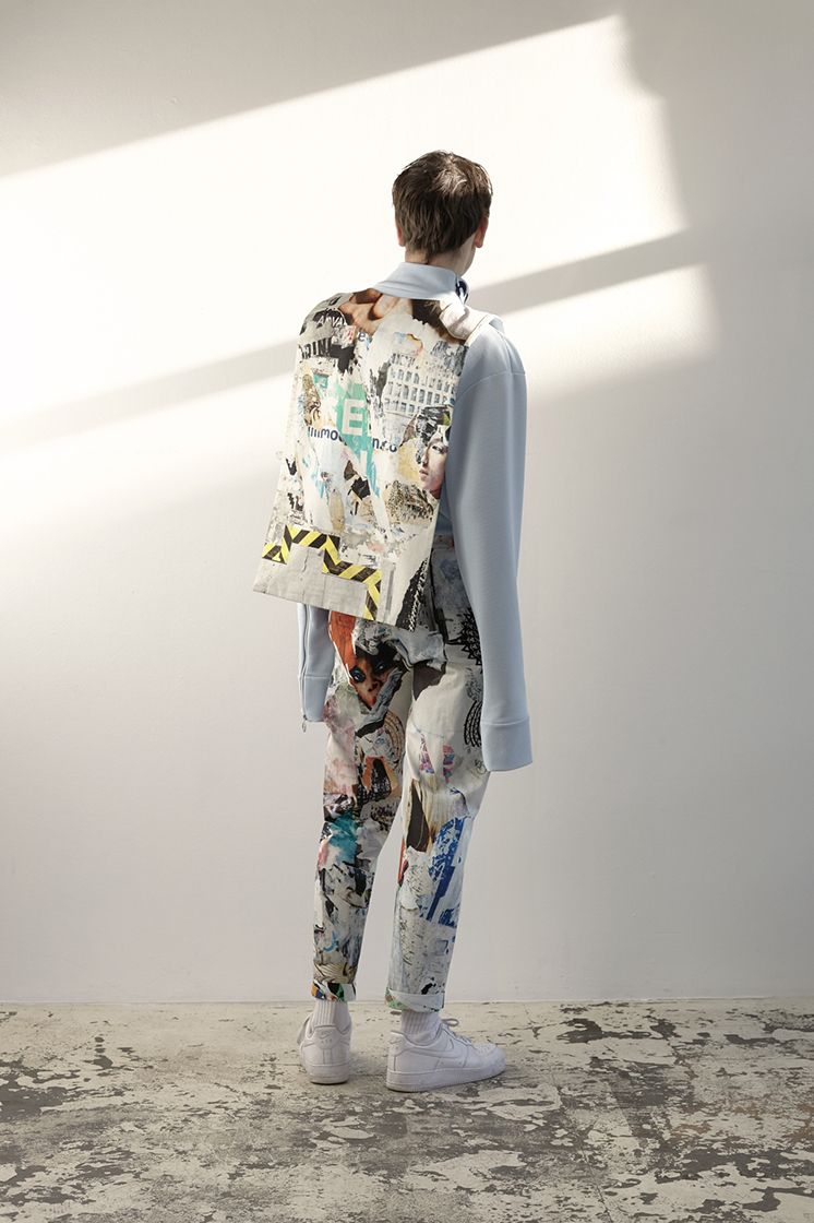 male model shown from the back in front of sun reflection