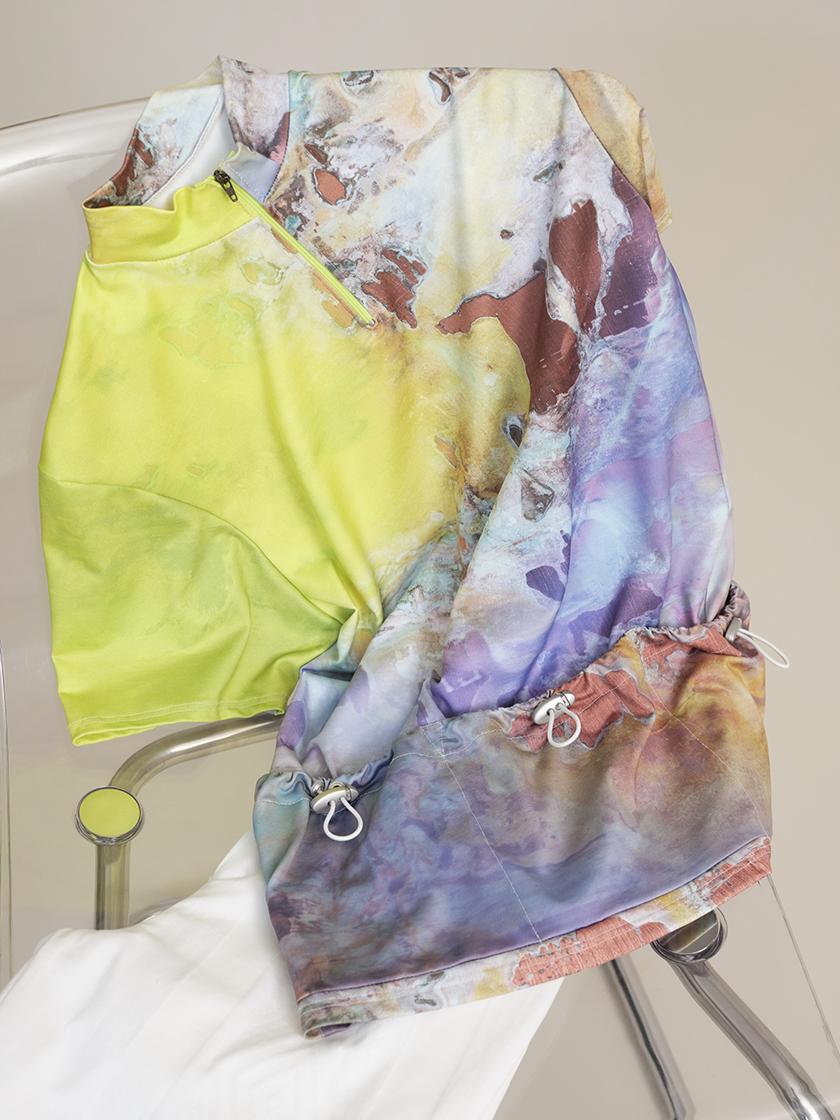 detail shot of print top laying on chair