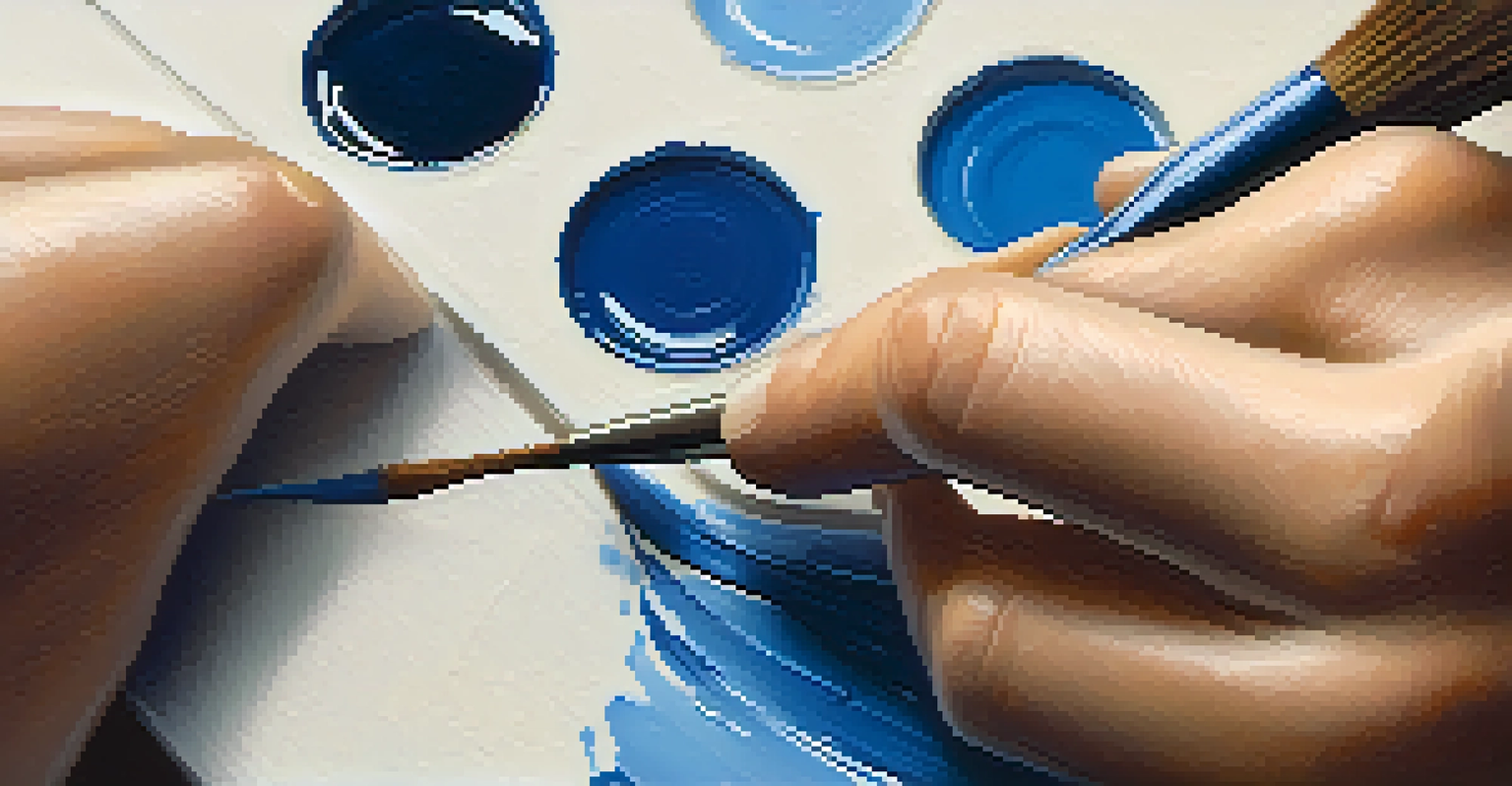 A close-up image of a painter's hand applying deep blue paint onto a textured canvas with a brush, highlighting the paint's thickness and texture.