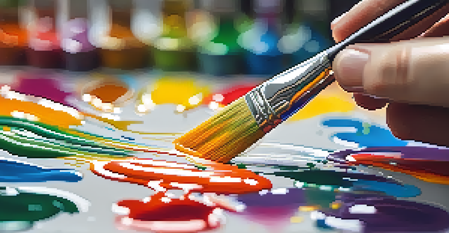 A close-up of a hand with a paintbrush over a colorful canvas, showcasing the vibrant paint and a blurred background of art supplies.
