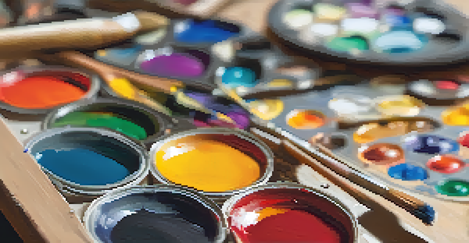 A wooden painter's palette with vibrant colors and paint smeared across it, with a blurred canvas in the background.