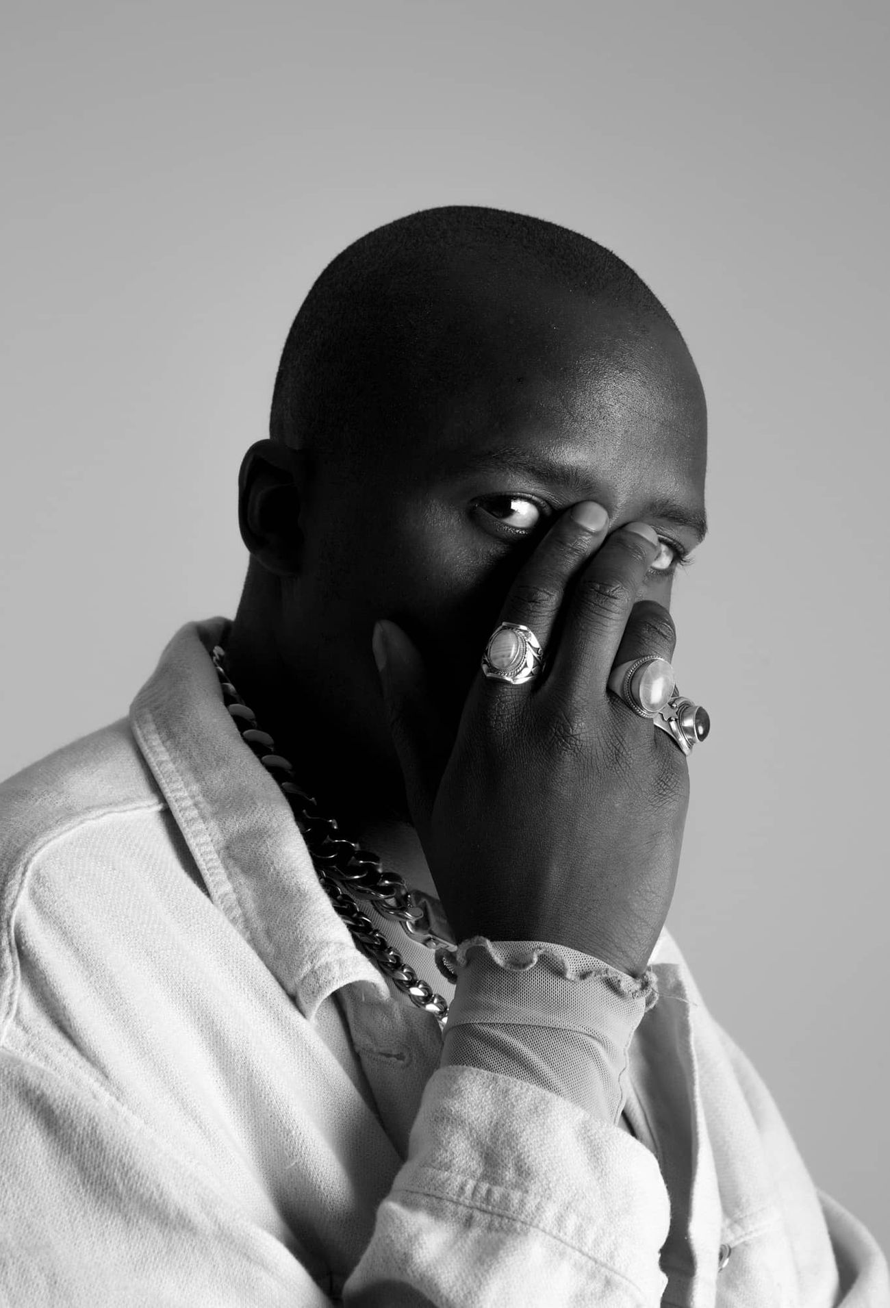 Black and white portrait photography of person wearing rings