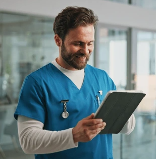 Doctor using best EMR system on Tablet by Canadian Health Systems