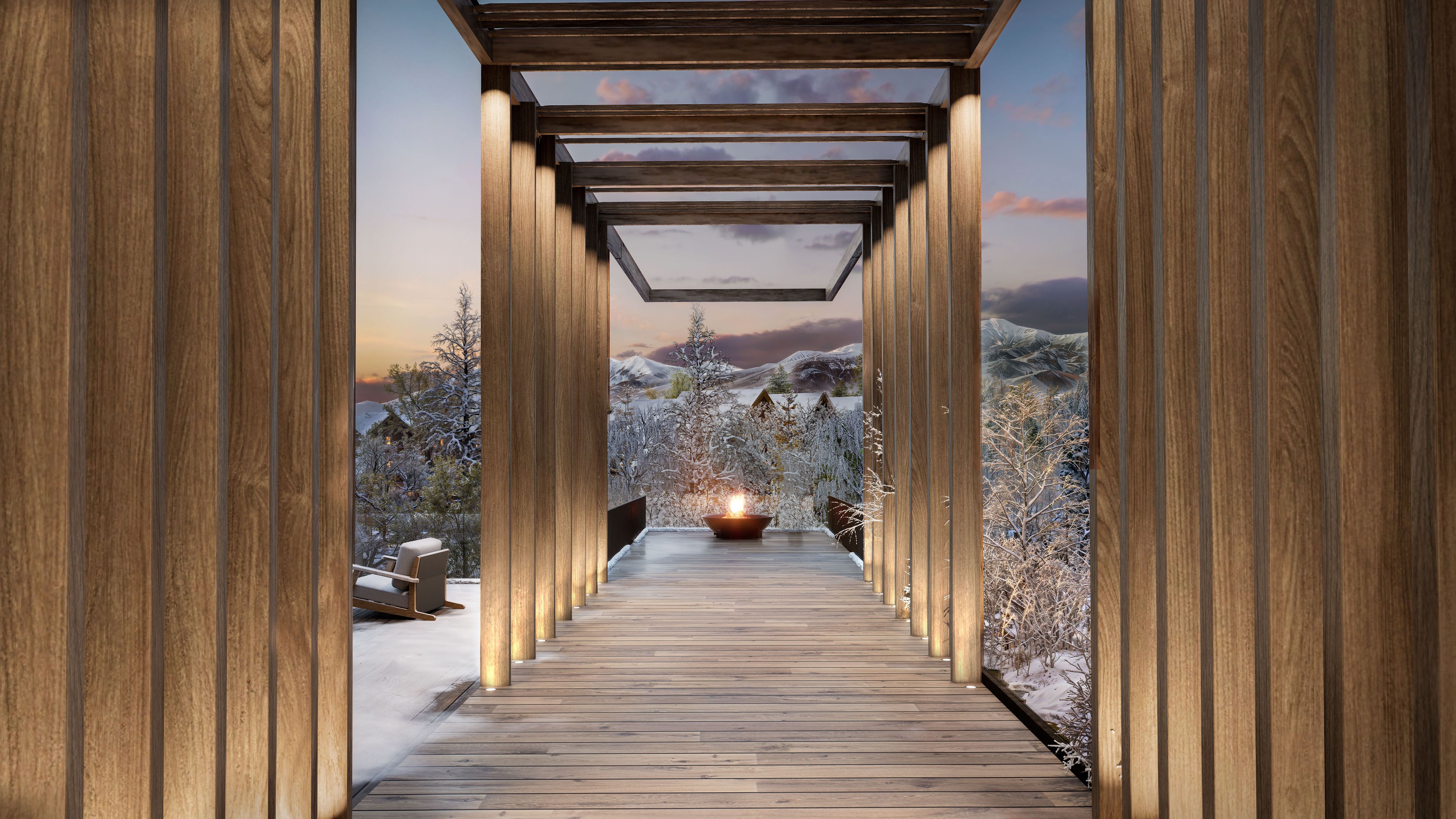 Wooden walkway and fire pit in a snow covered mountain setting