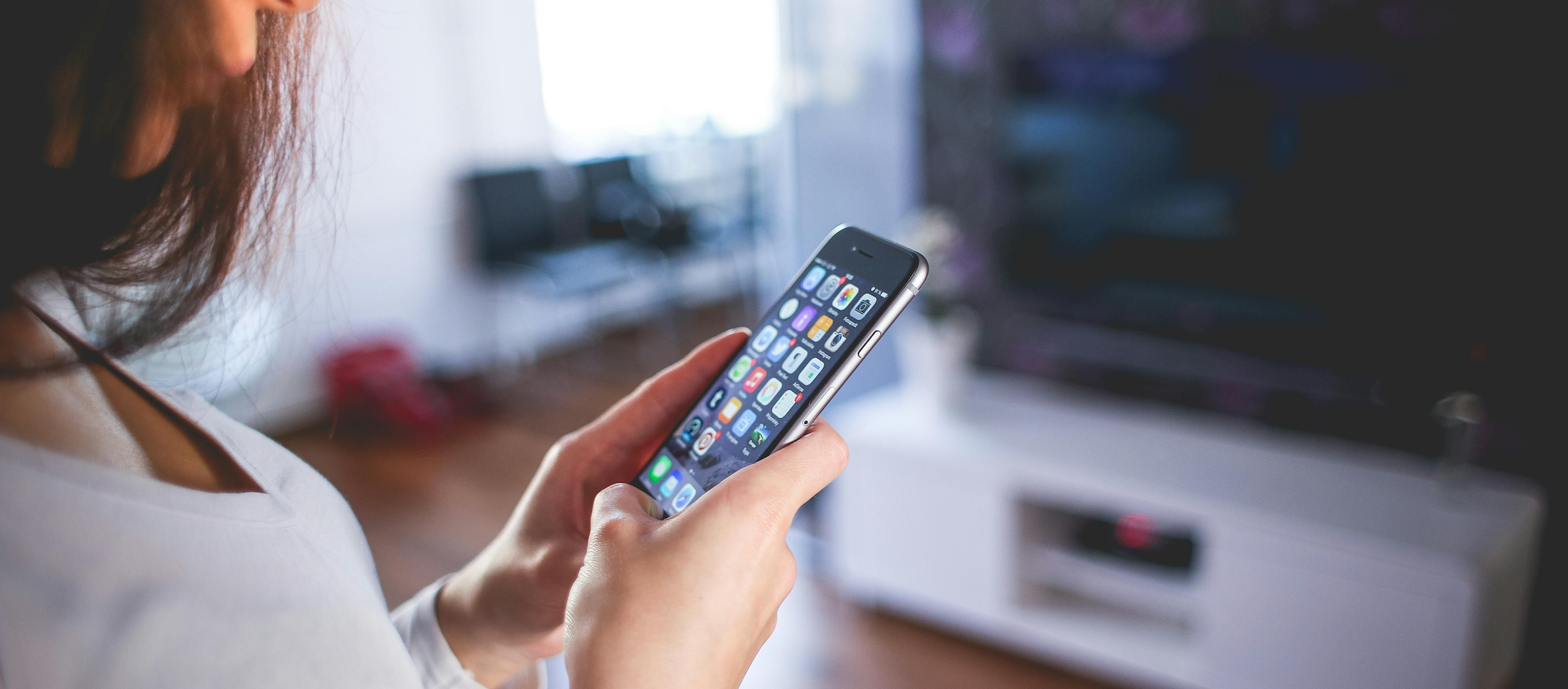 Woman Wearing White V Neck Shirt Using Space Gray Iphone 6