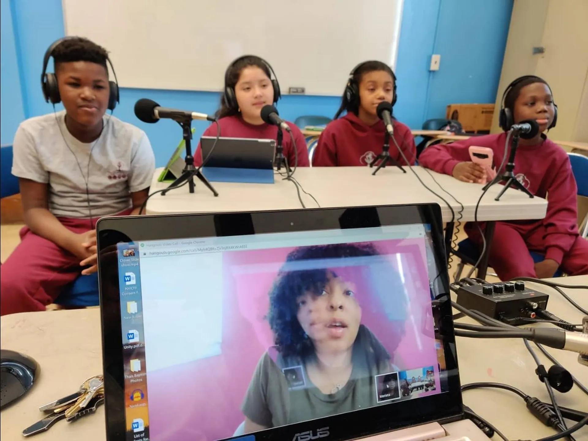 Students recording at microphones in the Media Arts Lab