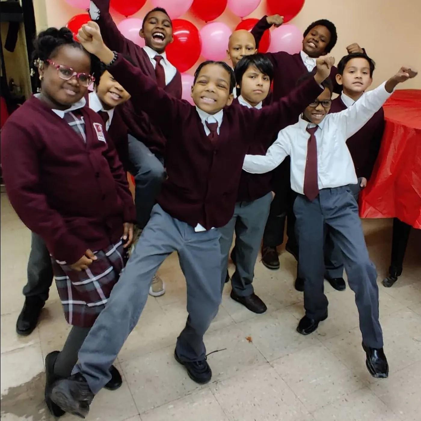 Learning Tree students celebrating together in the school hall