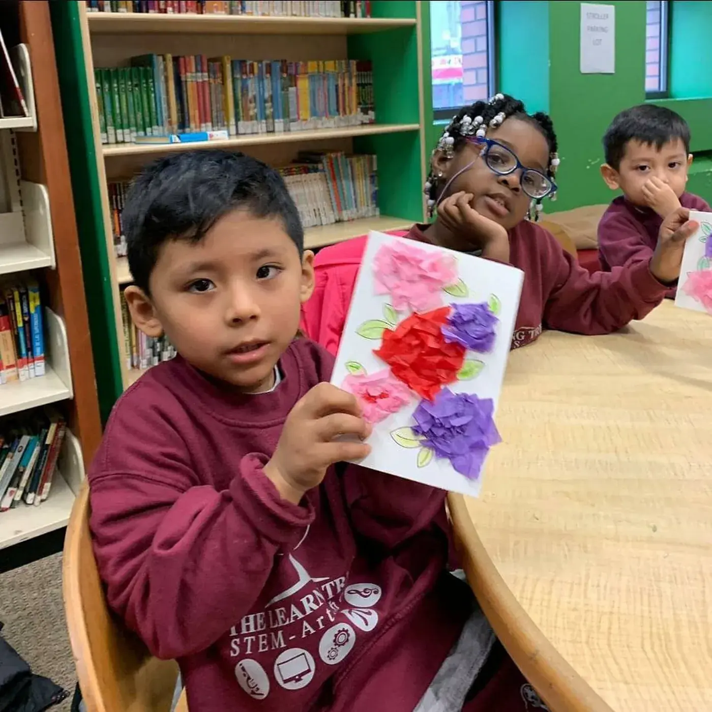 Students working at a table in the school library