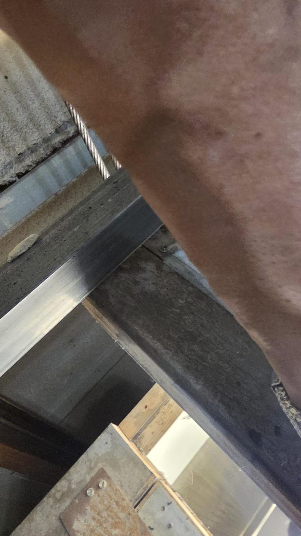 Equipment below the exit hatch opening of an elevator car