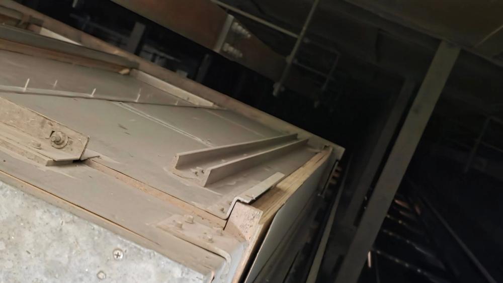 Elevator car shell showing wood construction