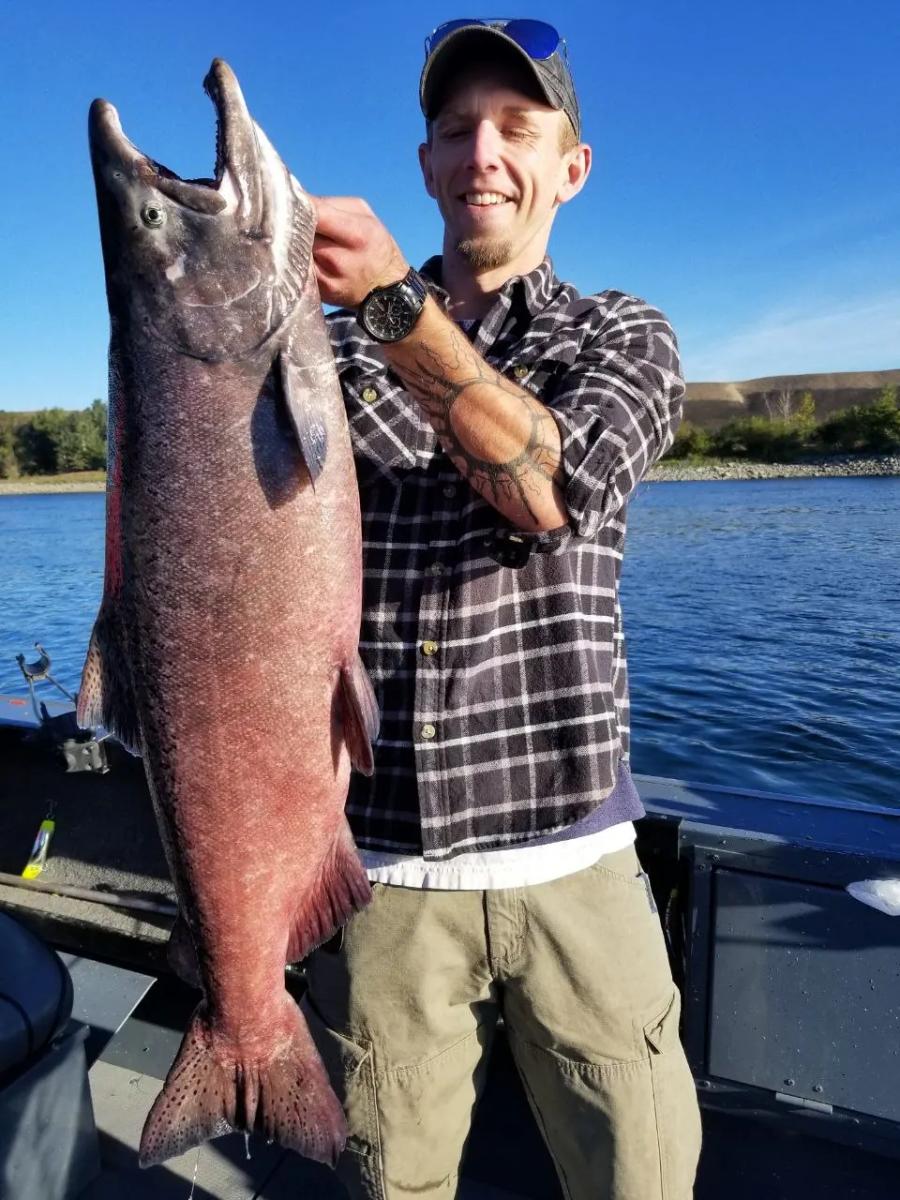 Angler holding a Hanford Reach salmon