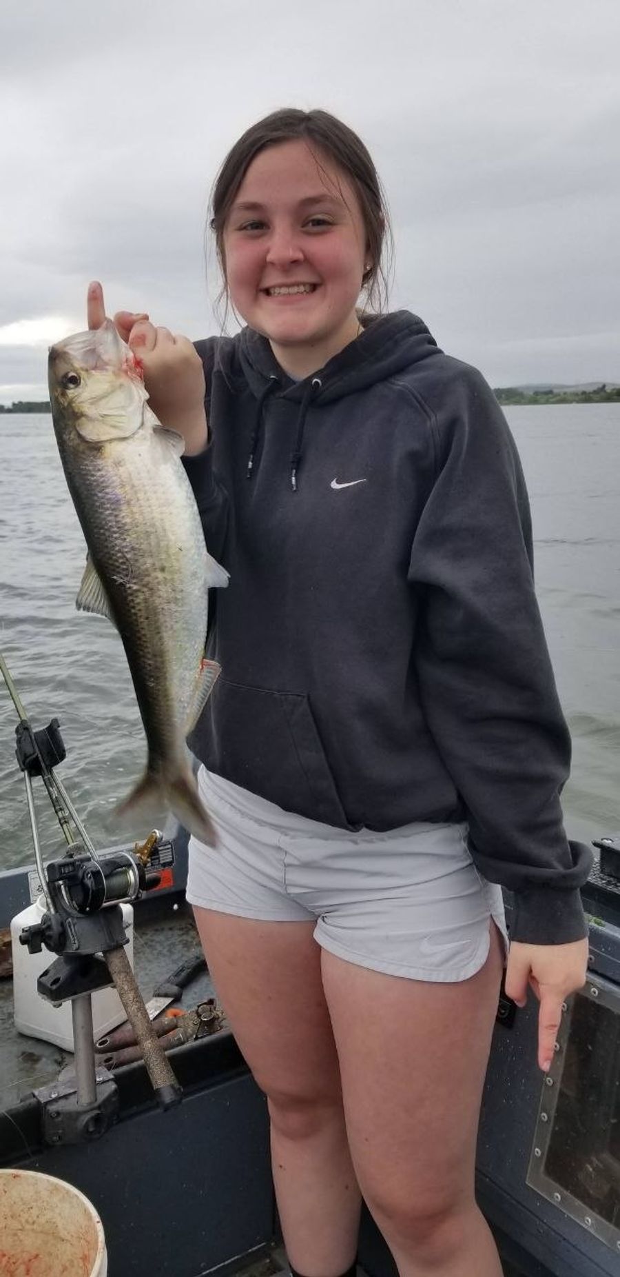 Girl holding a fish on the Columbia River