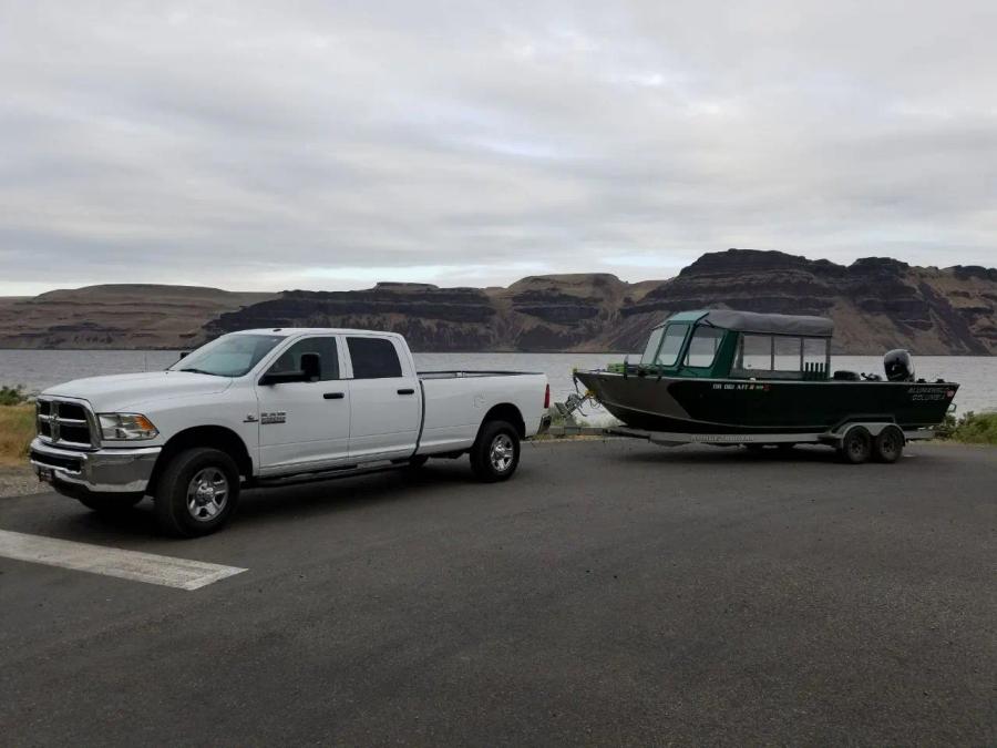 Fishing boat and truck at the river launch