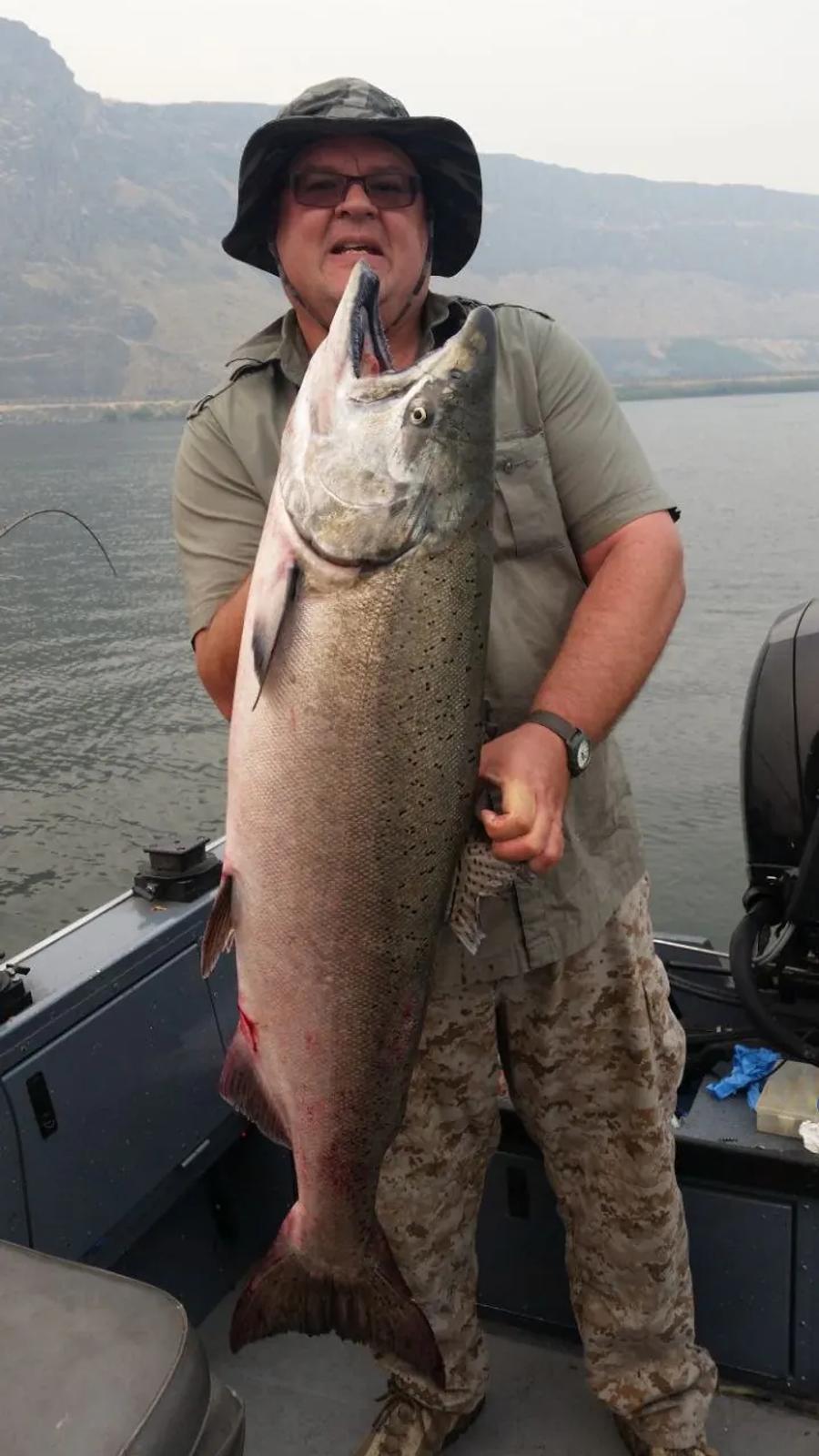 Angler holding a large salmon