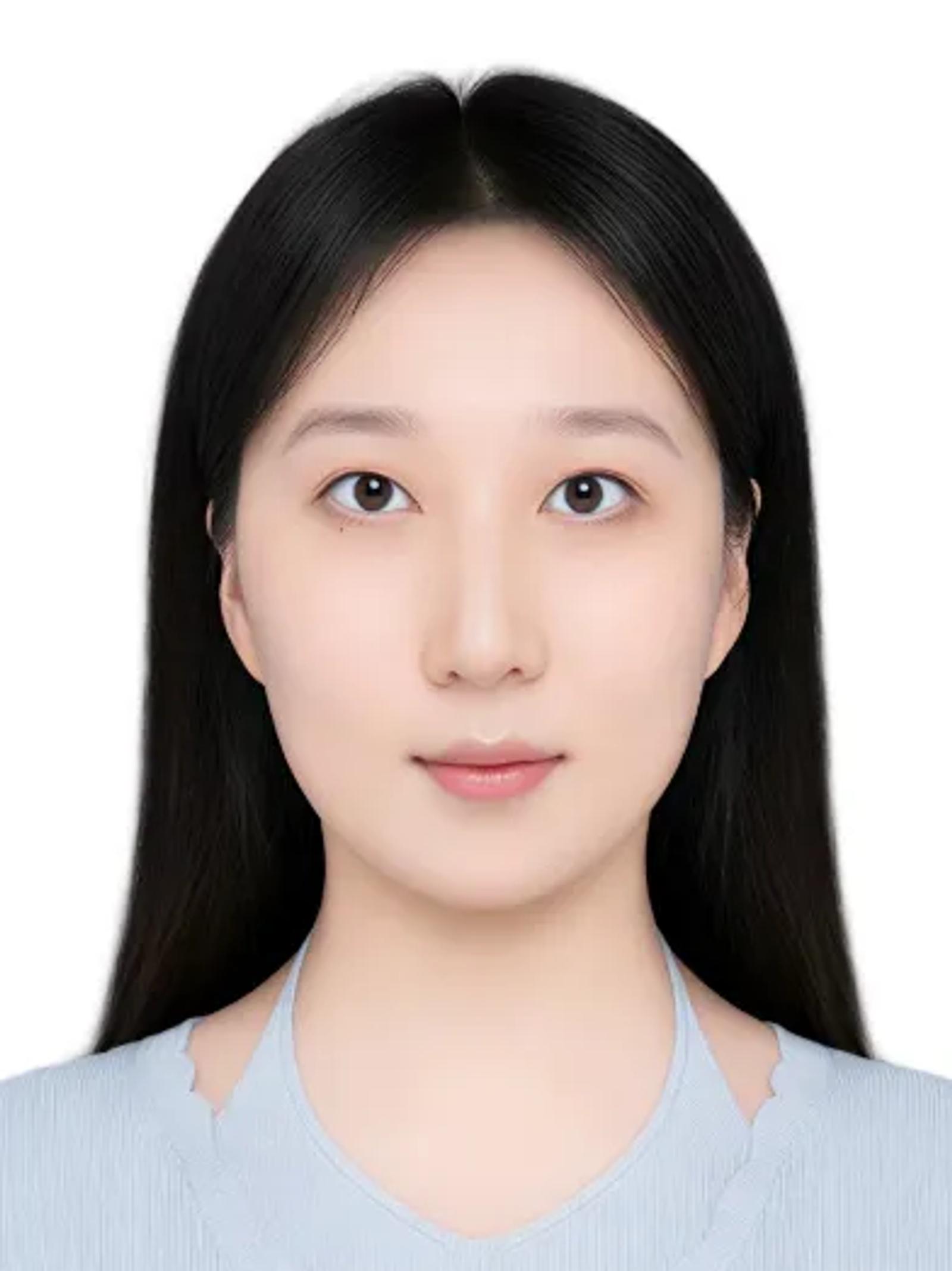 Wenyu Lyu faces the camera in a formal headshot, long dark hair framing her face above a pale blue top on a white background