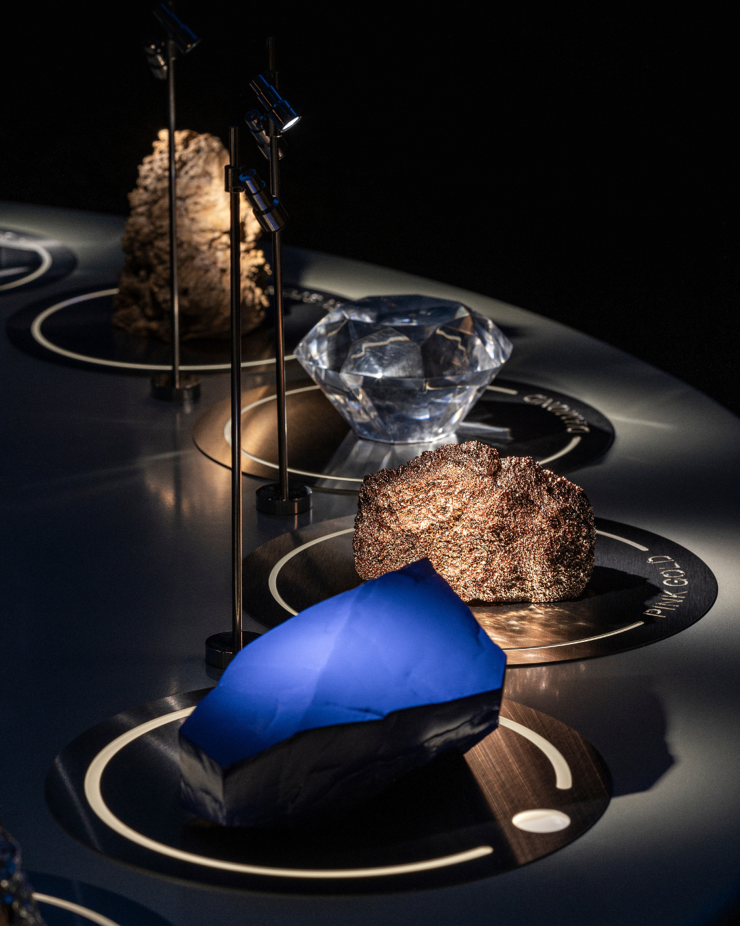 Interactive materials rooms featuring gold, platinum, titanium, carbon and ceramic at Audemars Piguet Shaping Materials exhibition in Milan.