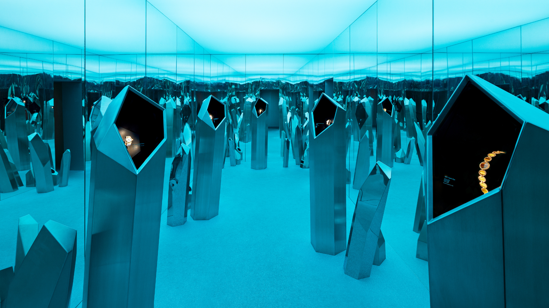 Immersive mirrored installation with Audemars Piguet watches displayed in metallic crystal structures at Shaping Materials exhibition in Milan.