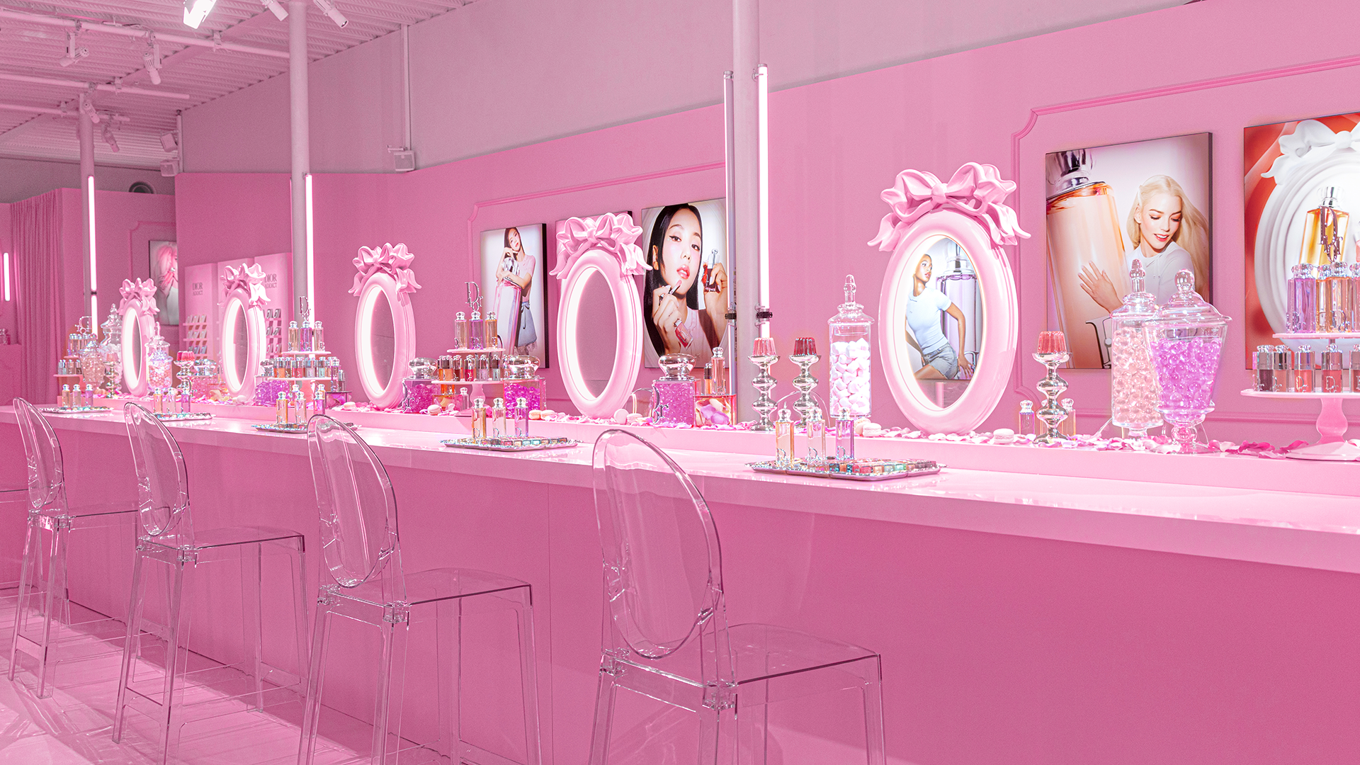 Pink make-up station room with candy bottles and Dior Beauty Lip Glow products at the Dior Sweet pop-up in Tokyo.