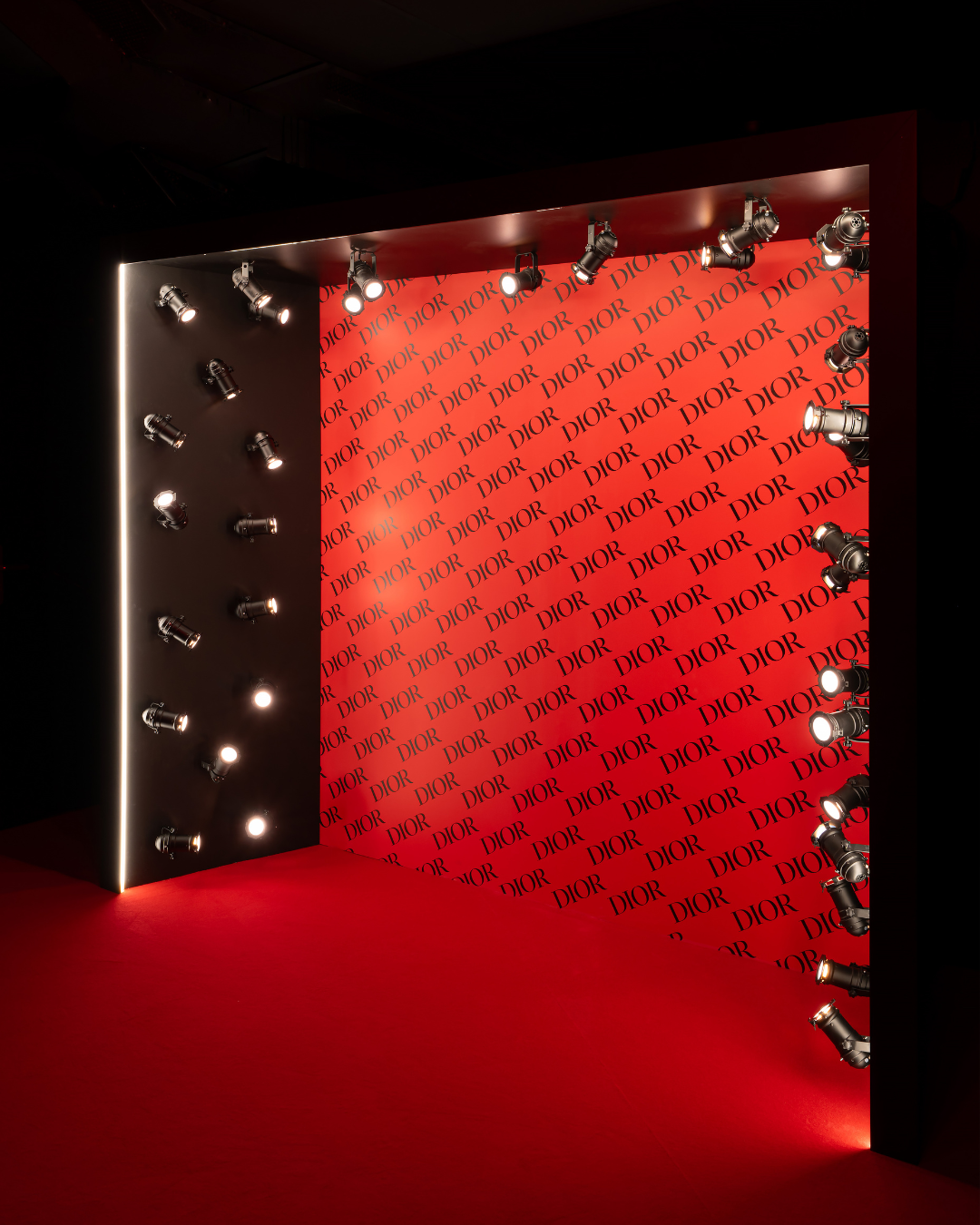 Black and red Dior photocall with branding details at Silencio Club in Paris.
