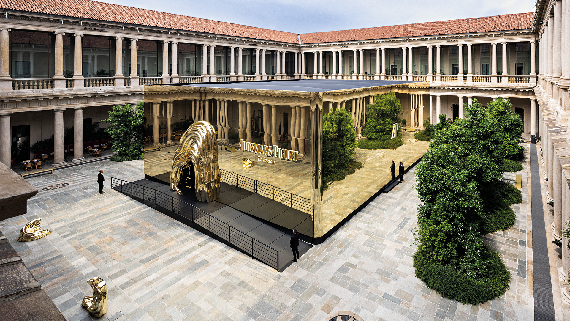 Gold cubic installation outside Portrait Milano for Audemars Piguet Shaping Materials exhibition in Milan