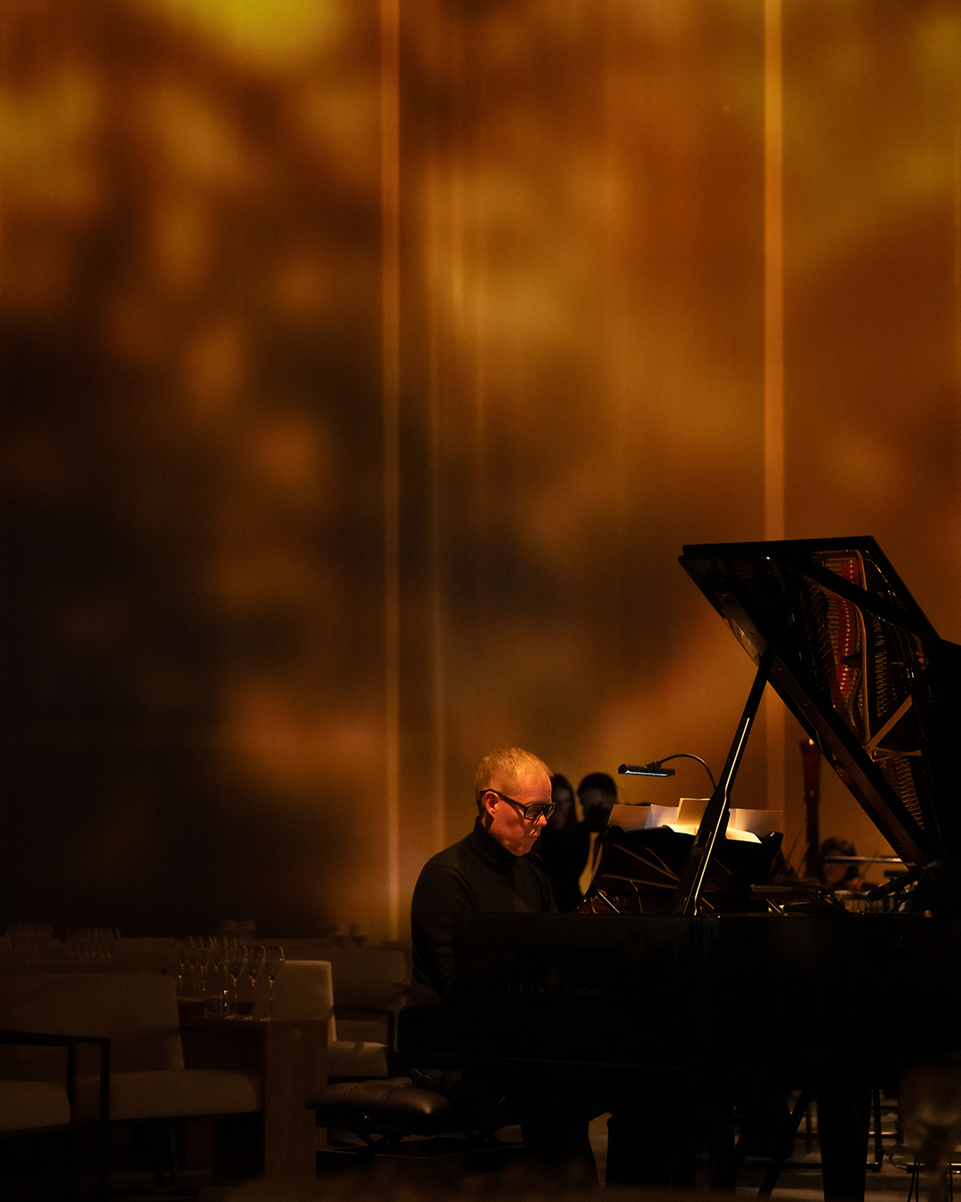 Max Richter playing piano at the Krug Every Note Counts music experience in London.